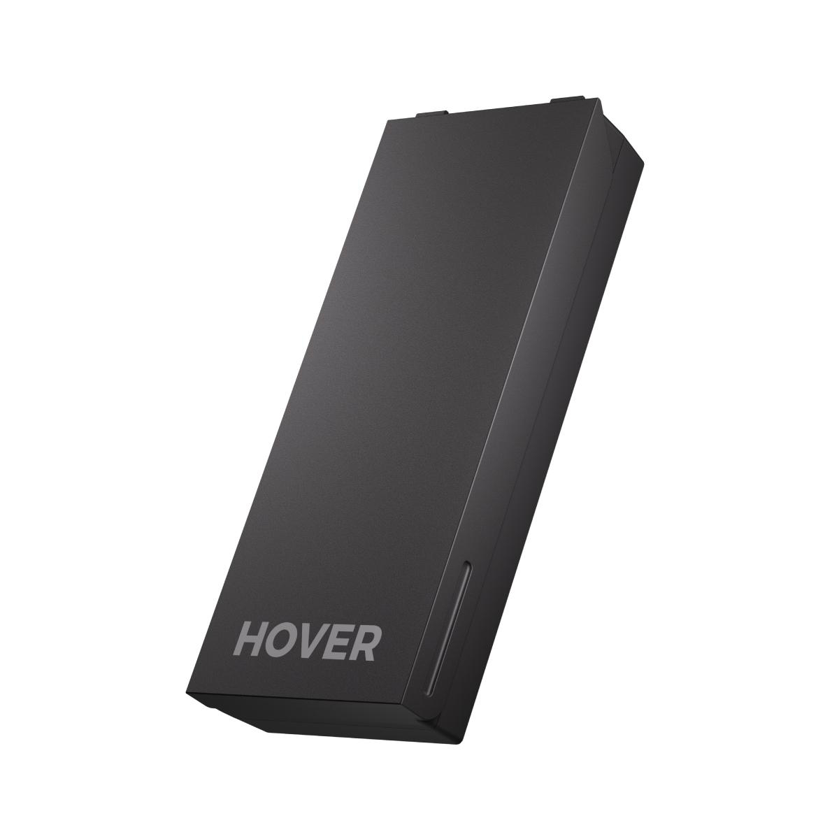 Ein schwarzes rechteckiges Gerät mit der Aufschrift 'HOVER'. Leicht angewinkelt. Weißer Hintergrund.