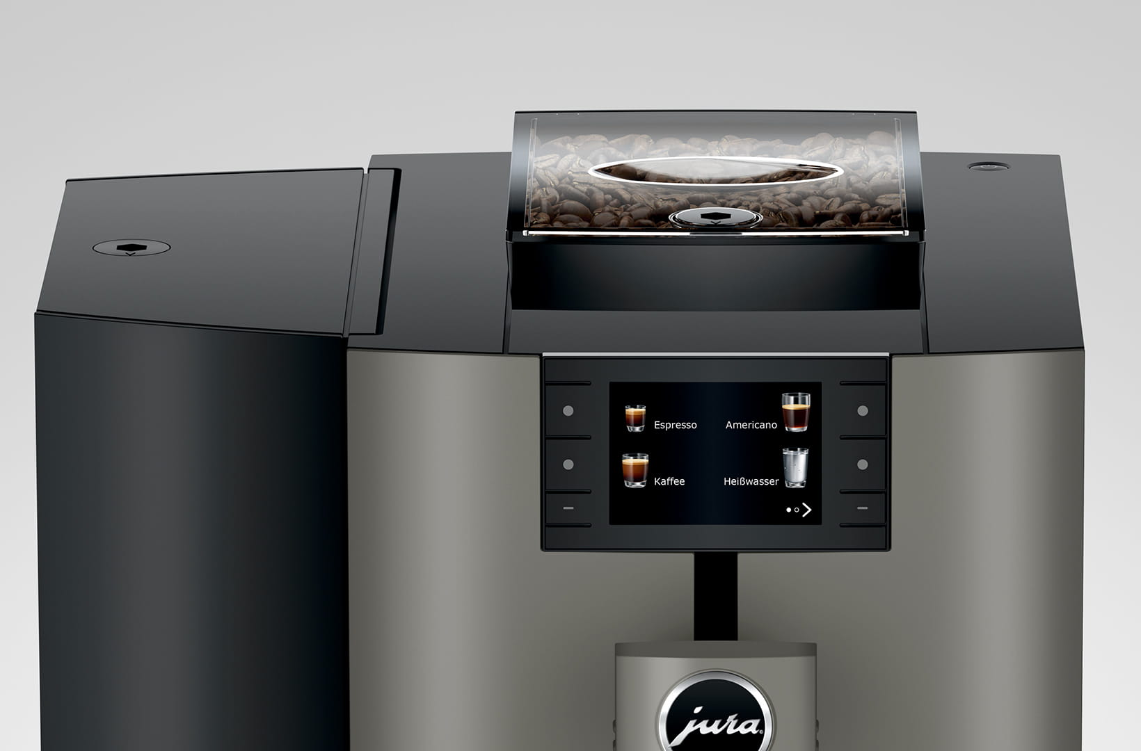 Una moderna macchina da caffè con chicchi di caffè in un contenitore trasparente. Ha un display digitale e il marchio 'jura' è visibile.