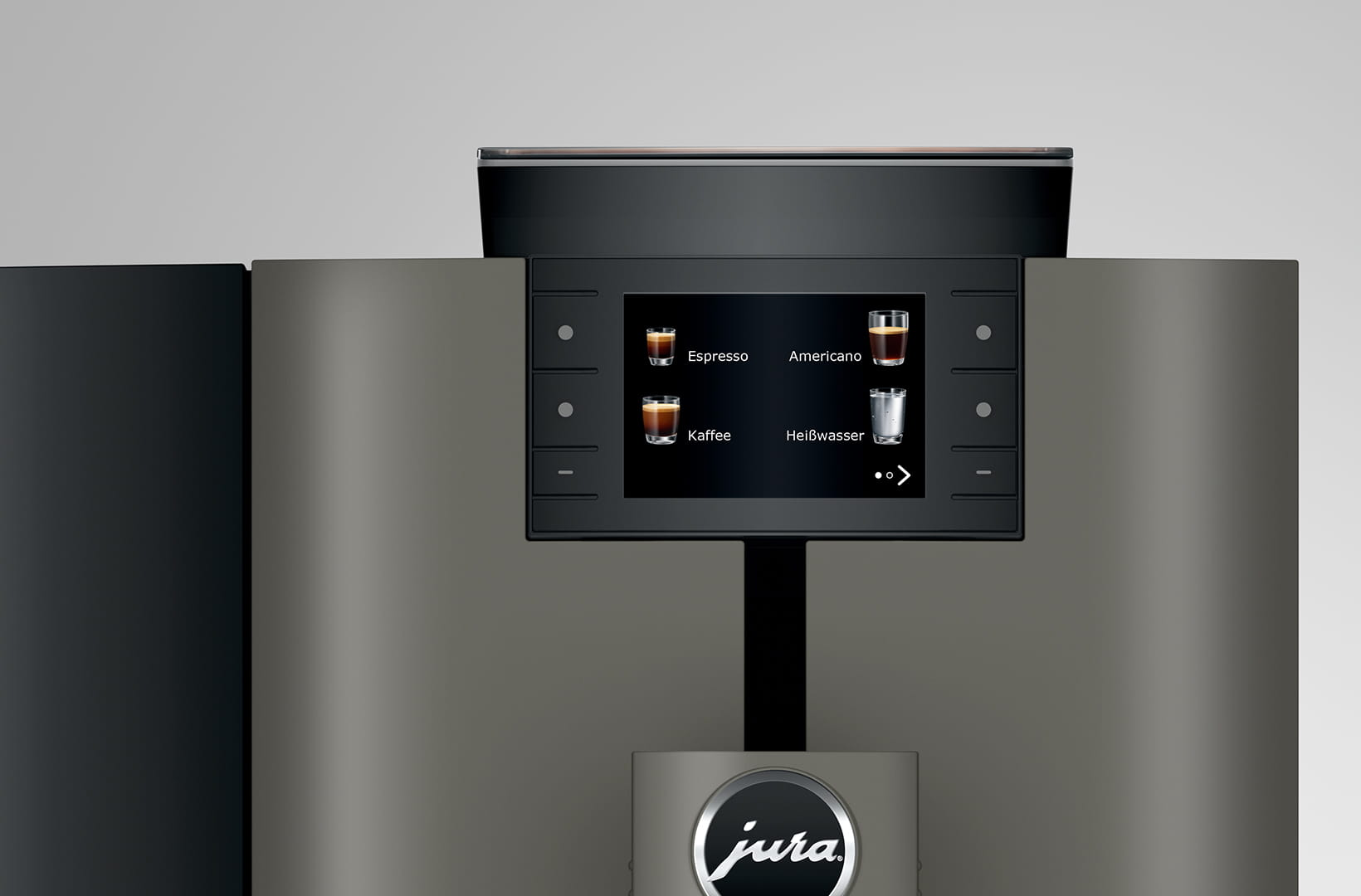 Una macchina da caffè con touchscreen che mostra le opzioni: Espresso, Americano, Kaffee e Heißwasser. Logo Jura in basso.