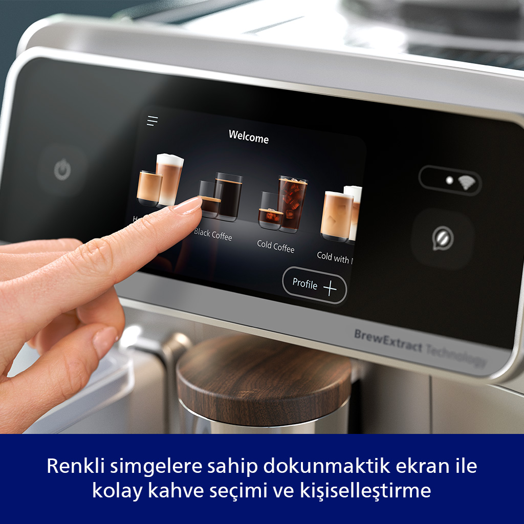 Bir el kahve makinesi ekranına dokunuyor. Kahve türleri için simgeler görüntüleniyor. Ekranda Hoş Geldiniz yazıyor ve bir profil düğmesi var.
