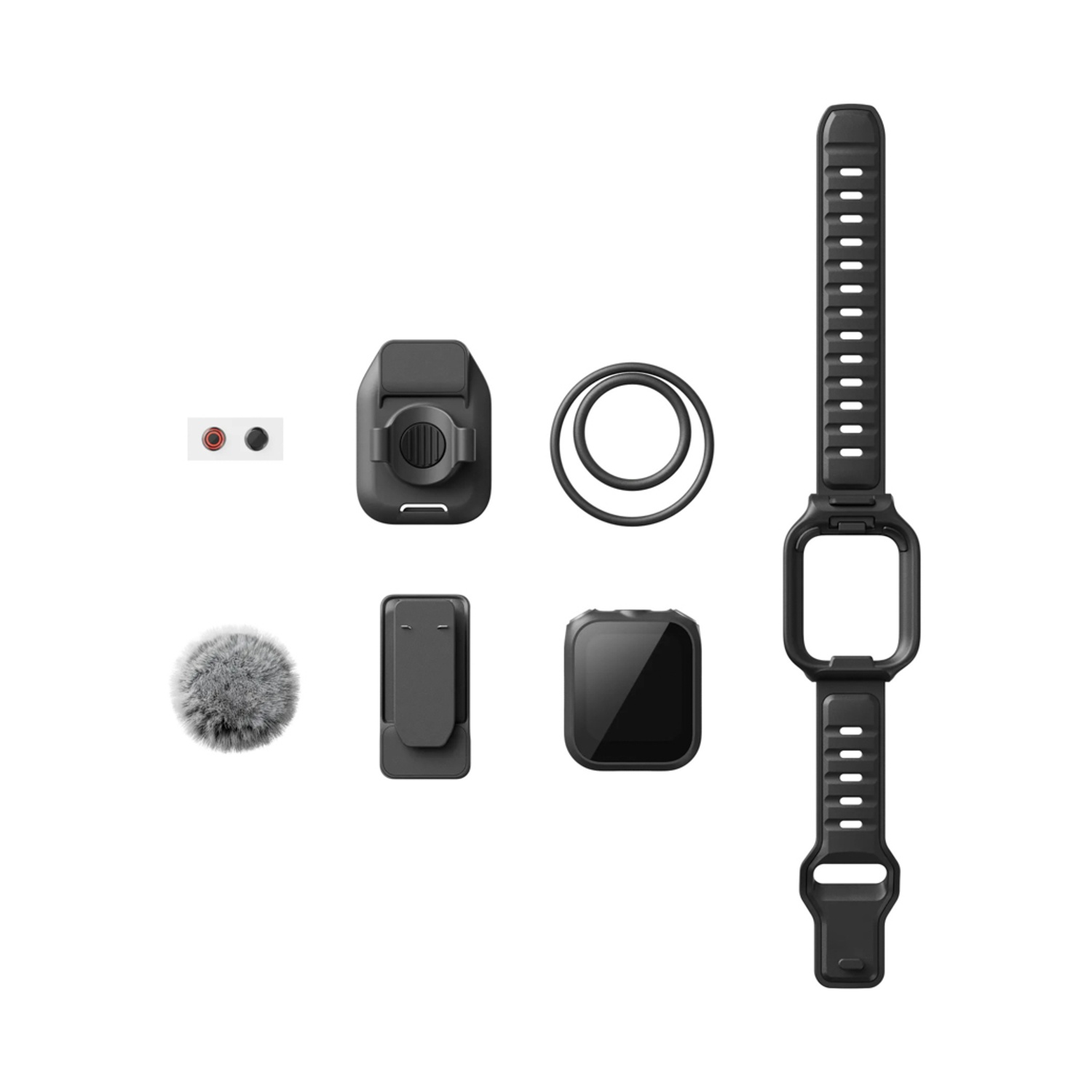 Accessori neri su sfondo bianco: cinturino, microfono, clip, anelli e un piccolo dispositivo quadrato.