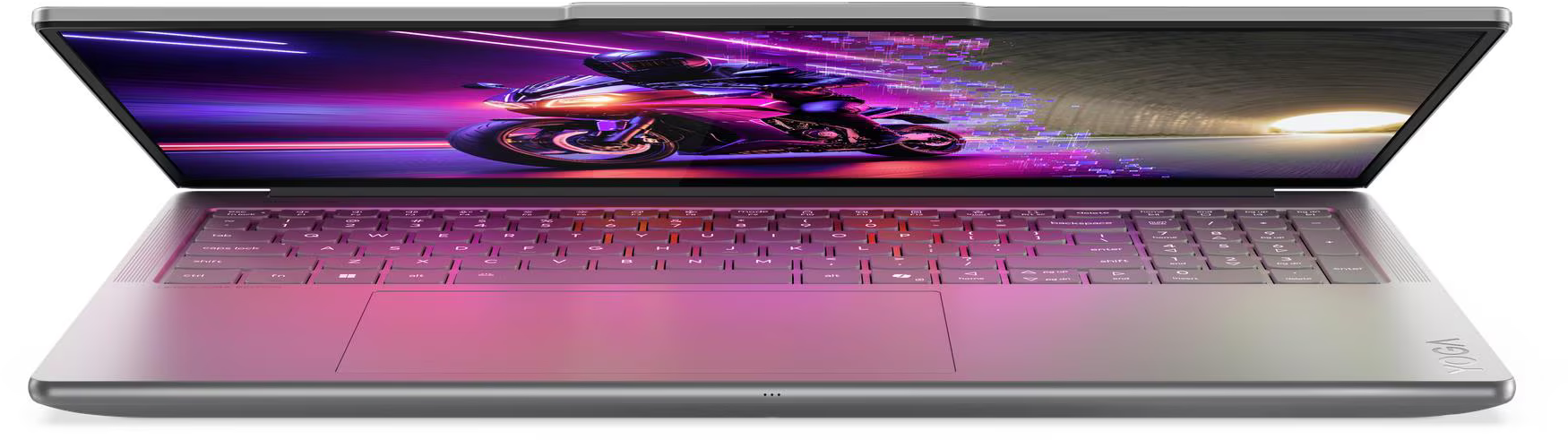 A nyitott laptop motorverseny jelenetet jelenít meg. A billentyűzet rózsaszín és lila színben világít. Ezüst színű.