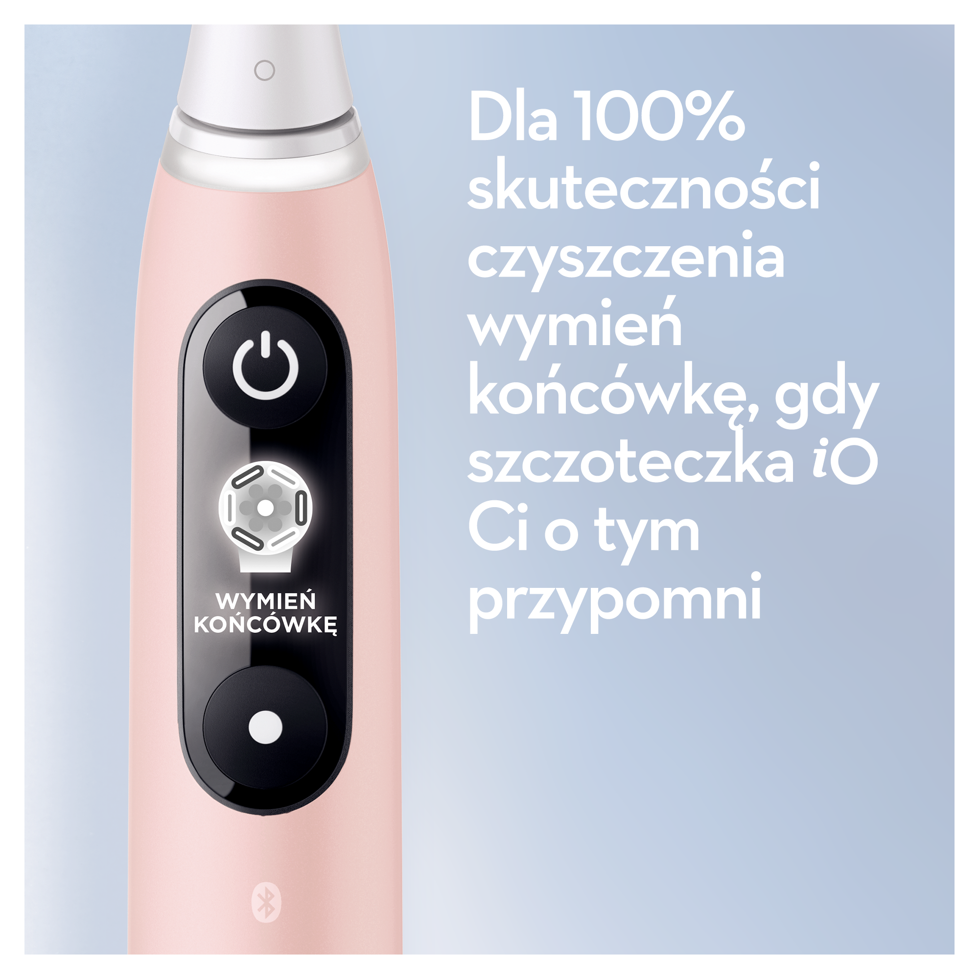 Różowa elektryczna szczoteczka do zębów z czarnymi przyciskami. Tekst mówi: Wymień główkę szczoteczki dla 100% skuteczności czyszczenia.