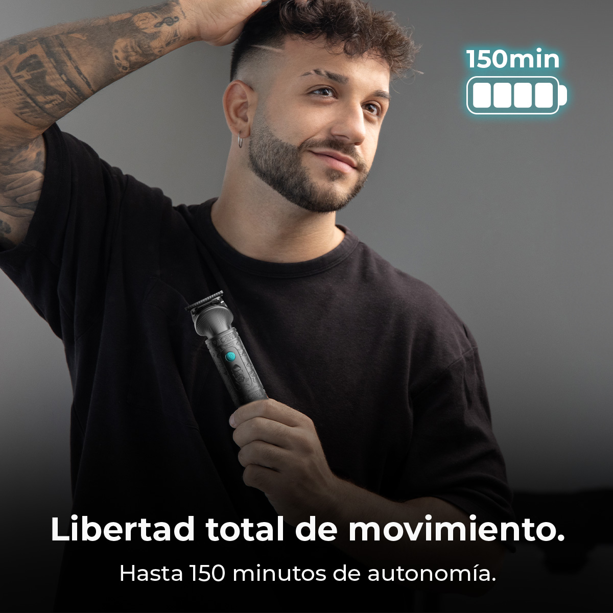 Hombre con cortapelos. Texto: 'Libertad total de movimiento' y 'Hasta 150 minutos de autonomía'. Con tatuaje en el brazo.