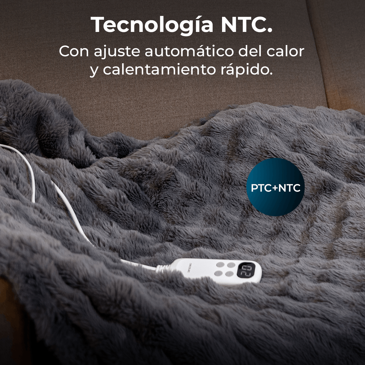 Una manta eléctrica gris con un controlador blanco. El texto en la manta dice 'Tecnología NTC' y 'PTC+NTC'.