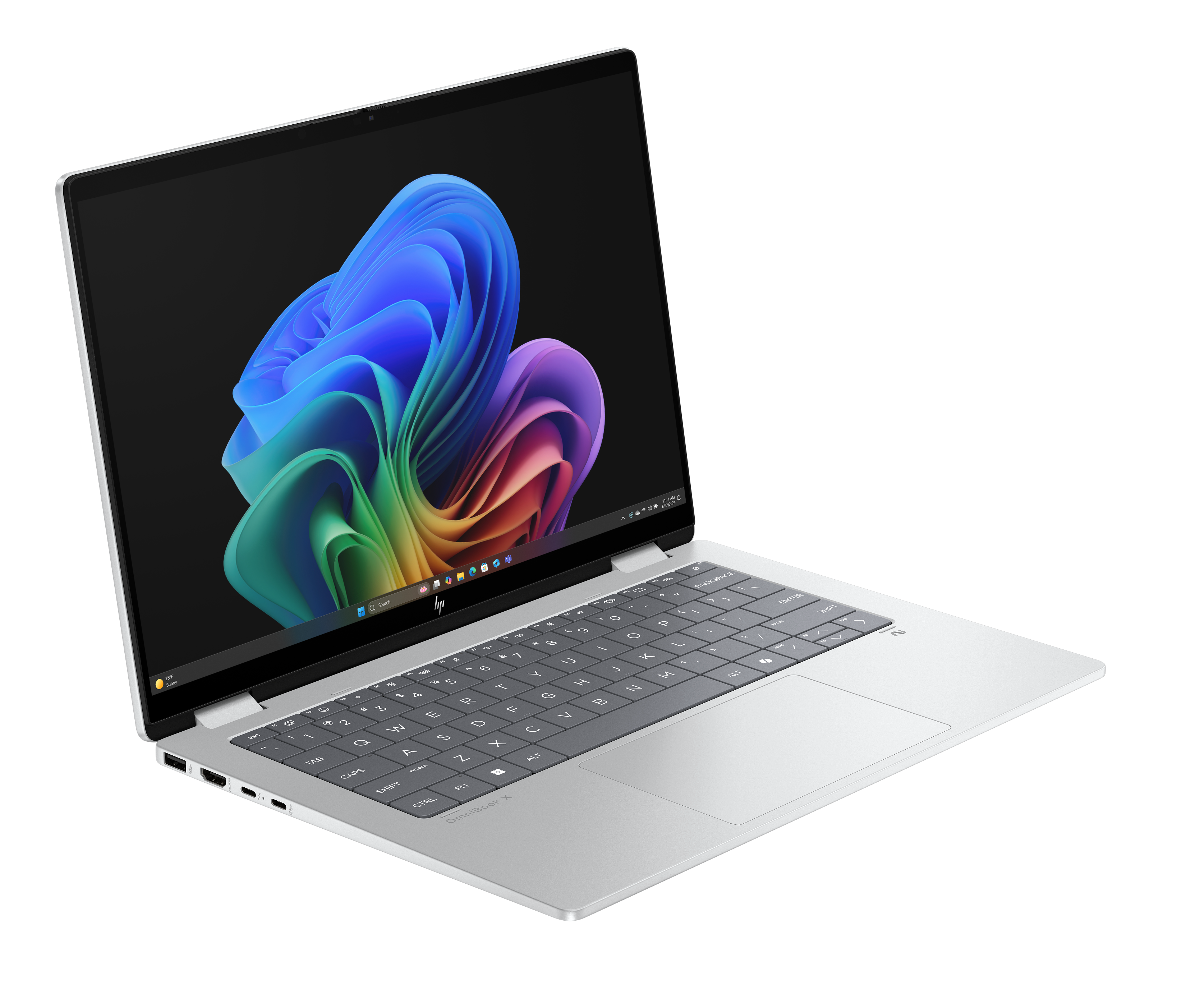 Srebrny laptop z ekranem pokazującym abstrakcyjne, kolorowe wiry, widoczna klawiatura. Czarne tło.