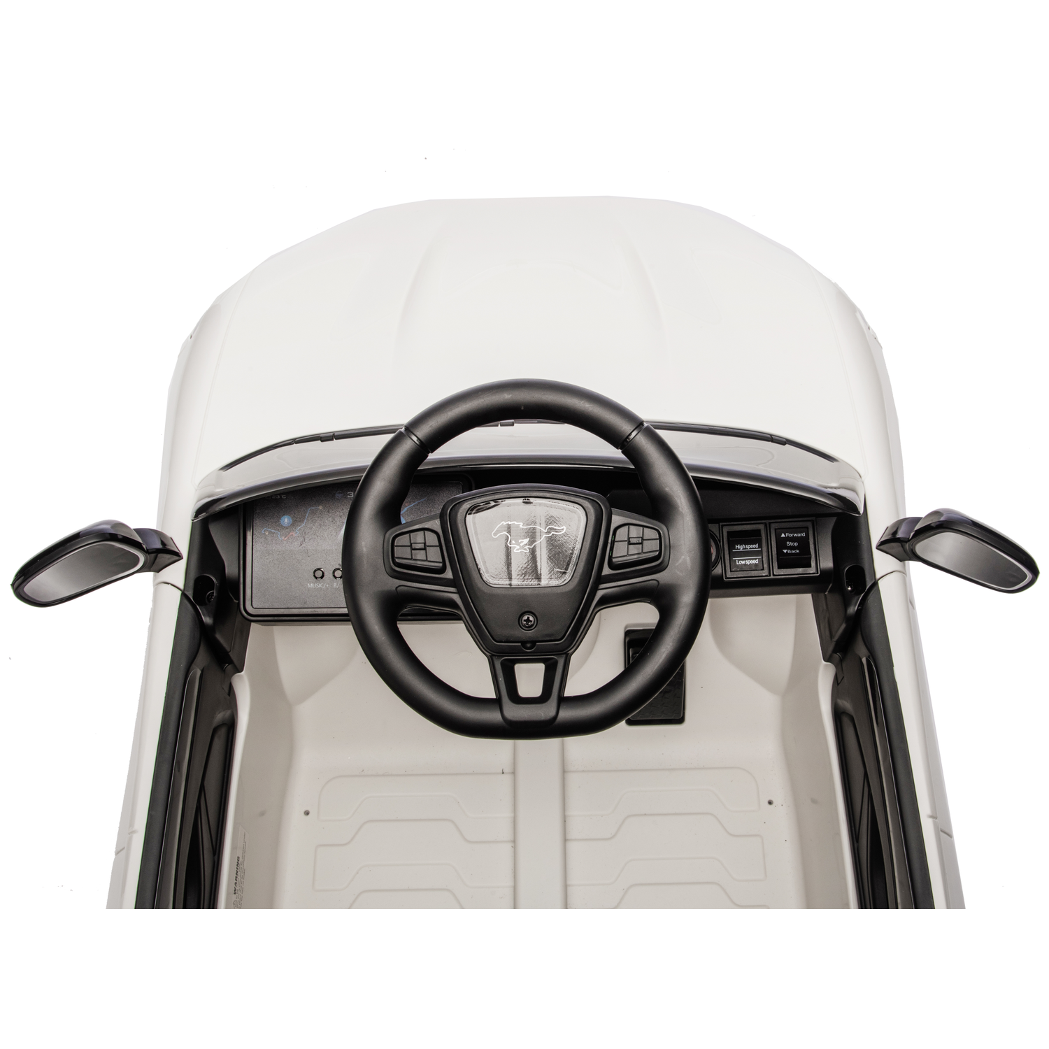 Top view of a white toy car interior. Black steering wheel, dashboard, and side mirrors are visible against white body.
