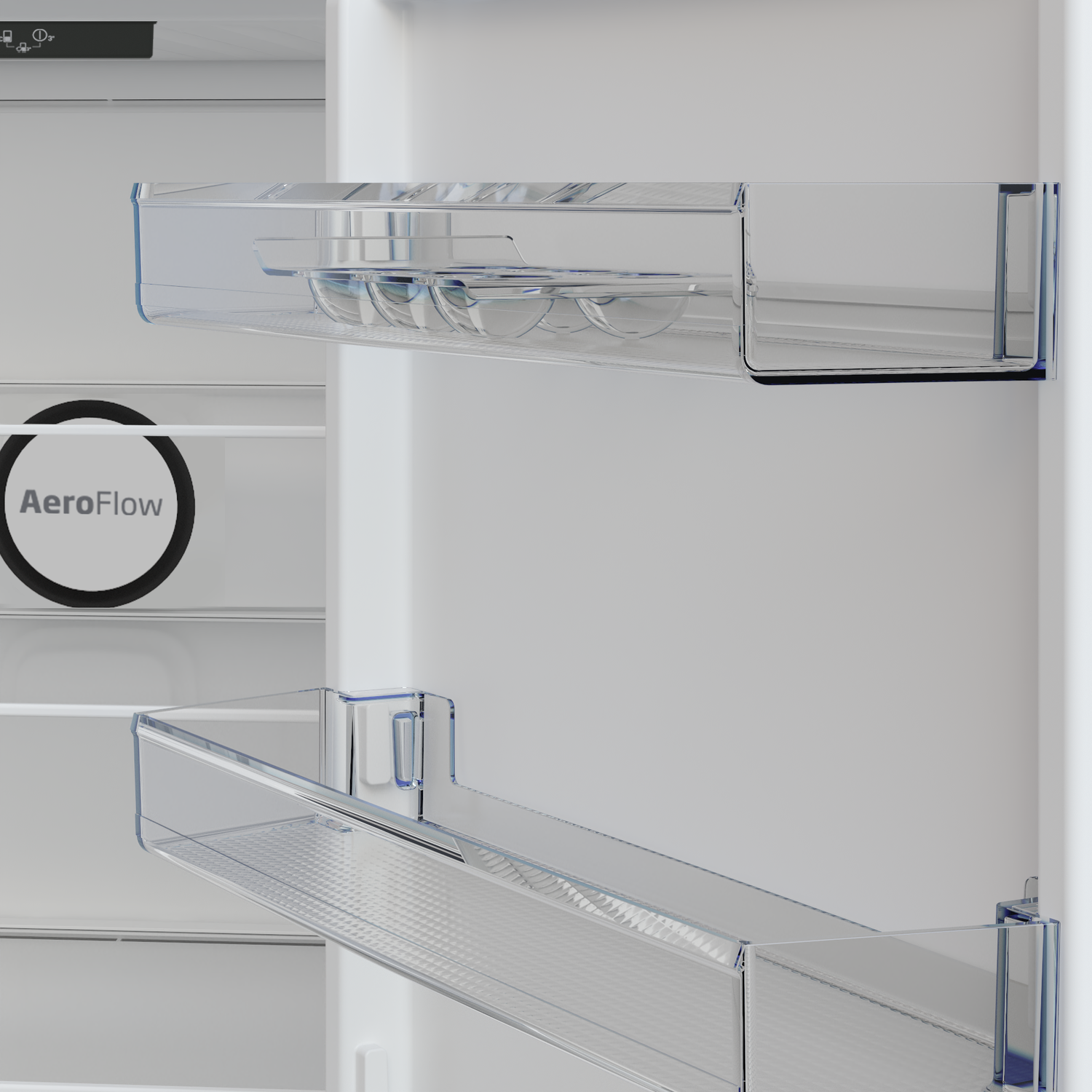 Inside a fridge: clear shelves and door compartments. AeroFlow logo visible. Upper shelf holds egg holders.