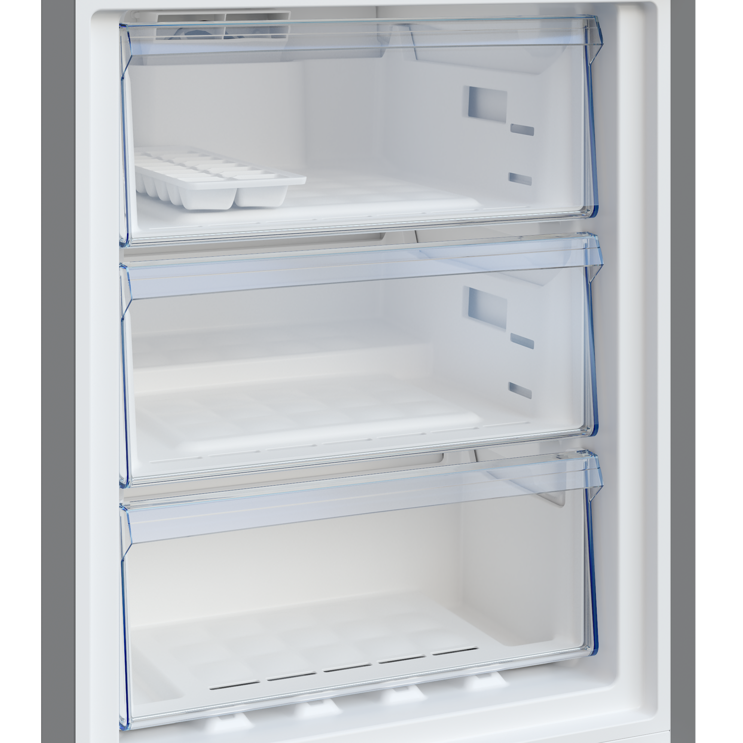 Inside a white freezer with three transparent drawers. An ice cube tray sits in the top drawer. The freezer is empty.