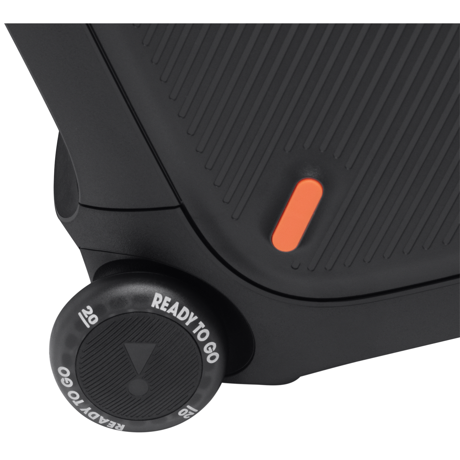 Close-up of a black speaker with an orange button and a wheel labeled 'READY TO GO' and '20'.