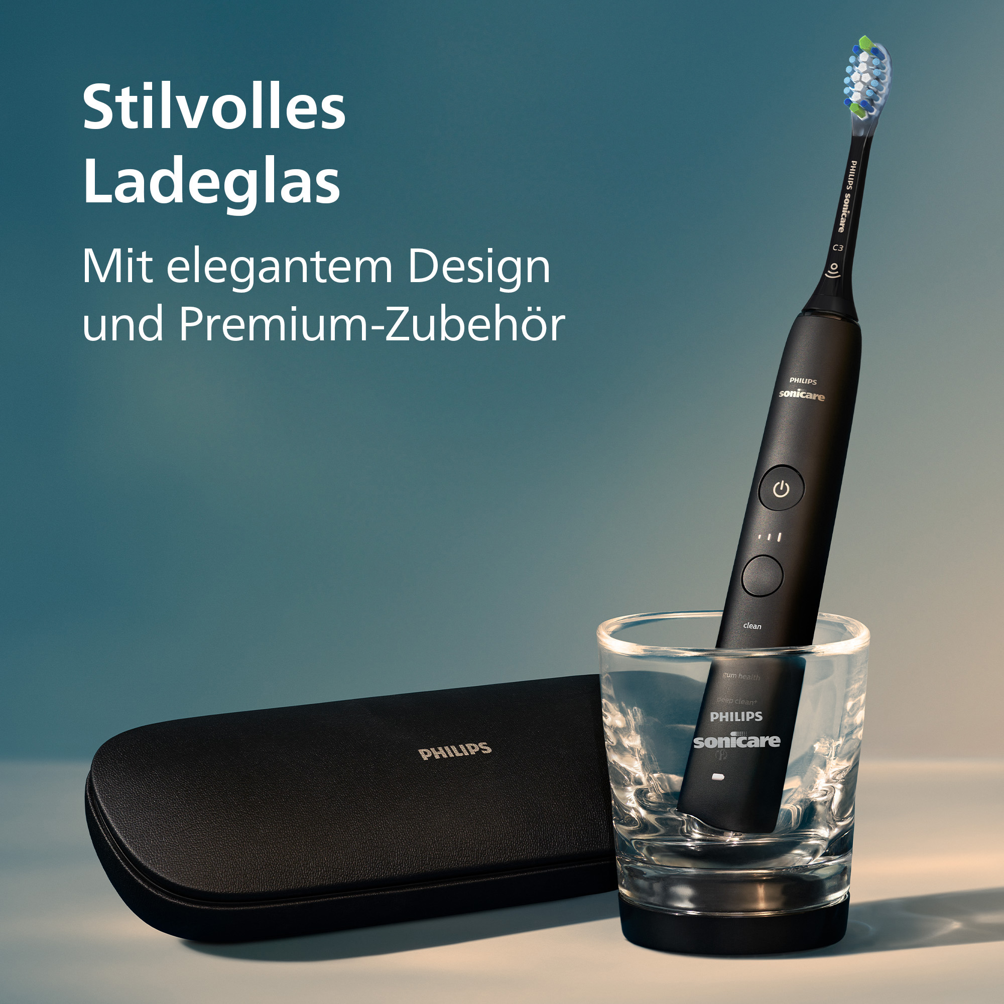 Une brosse à dents Philips Sonicare noire dans un verre, à côté d'un étui noir. Texte : 'Stilvolles Ladeglas' et 'PHILIPS'.