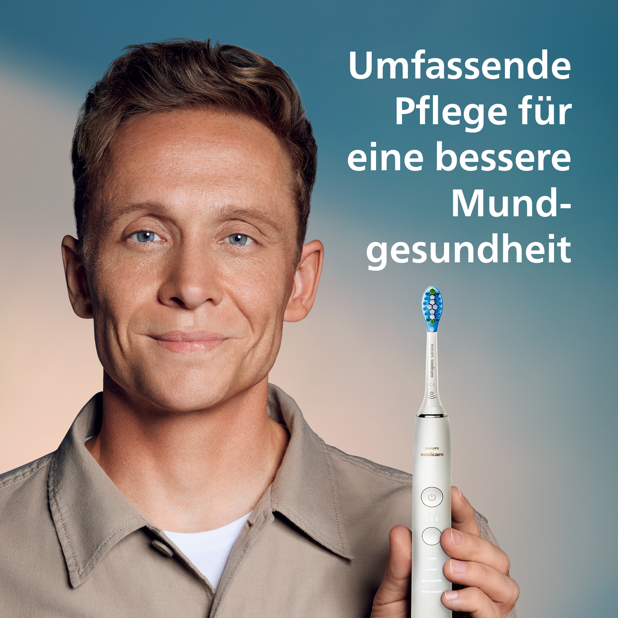 Un homme tient une brosse à dents Philips Sonicare blanche. Texte en allemand : Soins complets pour une meilleure santé bucco-dentaire.