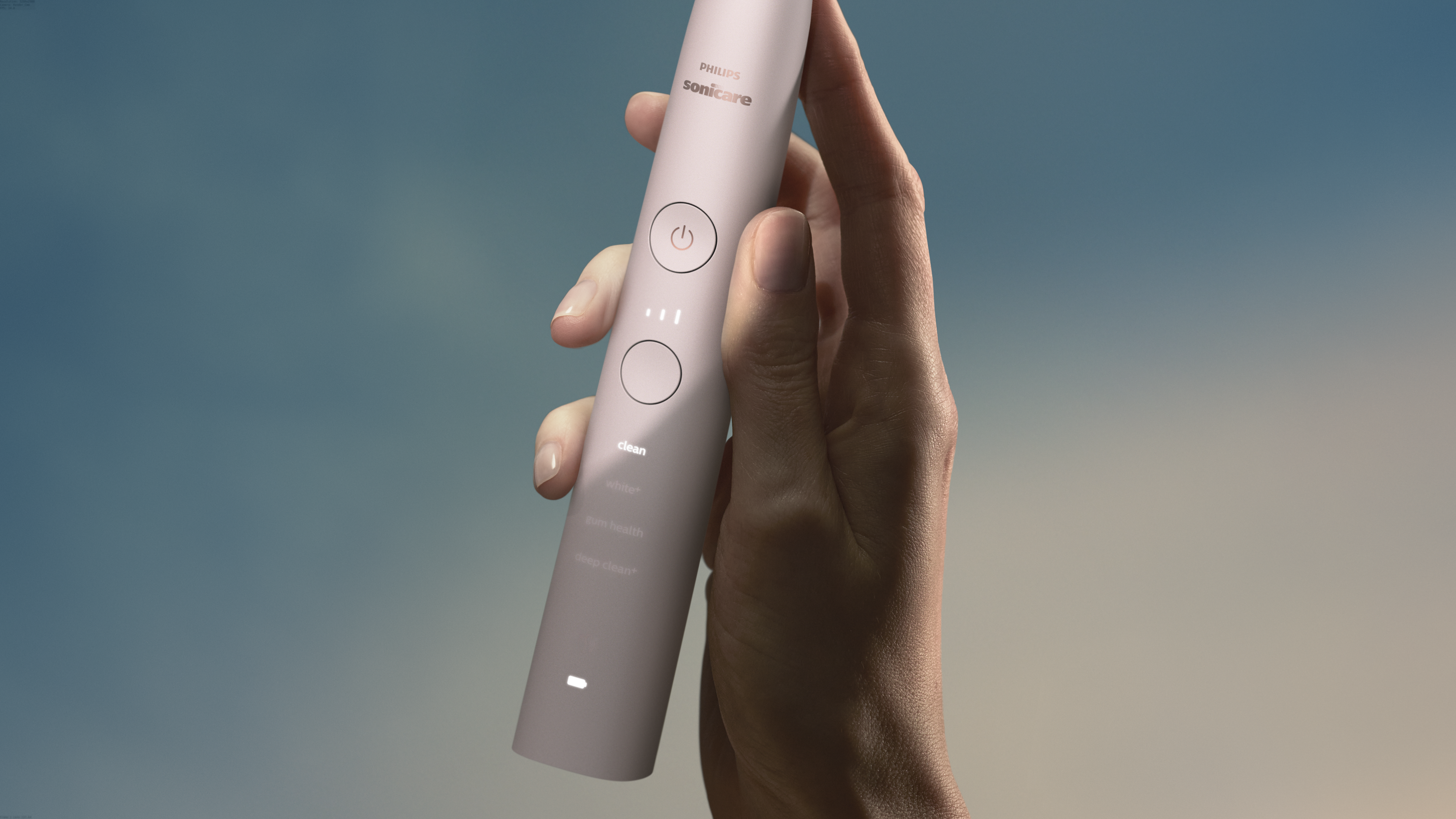 Une main tient une brosse à dents rose Philips Sonicare. Le fond est un dégradé de bleu et beige.