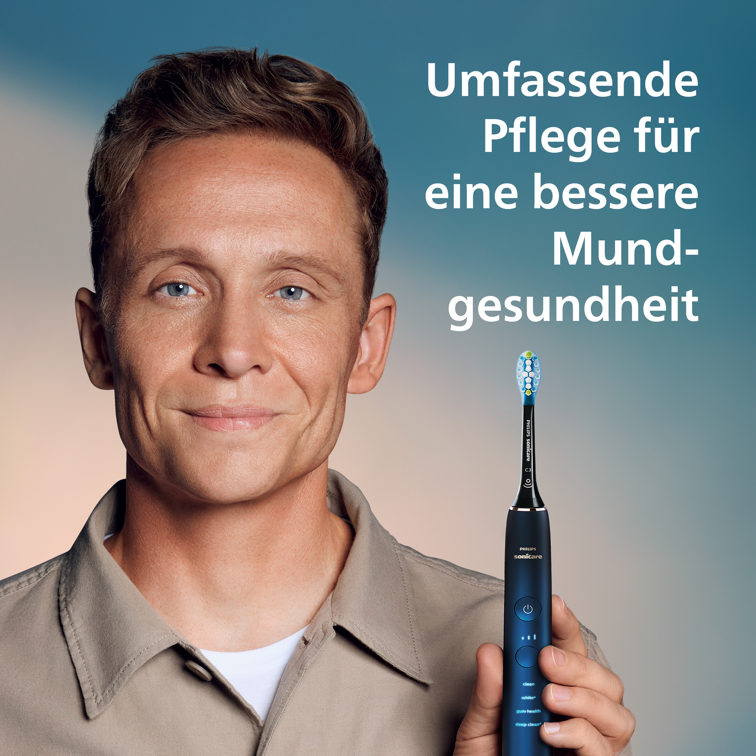 Un uomo tiene in mano uno spazzolino Philips Sonicare. Testo tedesco: 'Cura completa per una migliore salute orale'.