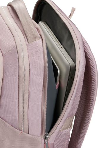 Różowy plecak jest częściowo rozpięty, ukazując laptopa i tablet w środku. Plecak ma siatkową stronę i zamek błyskawiczny.