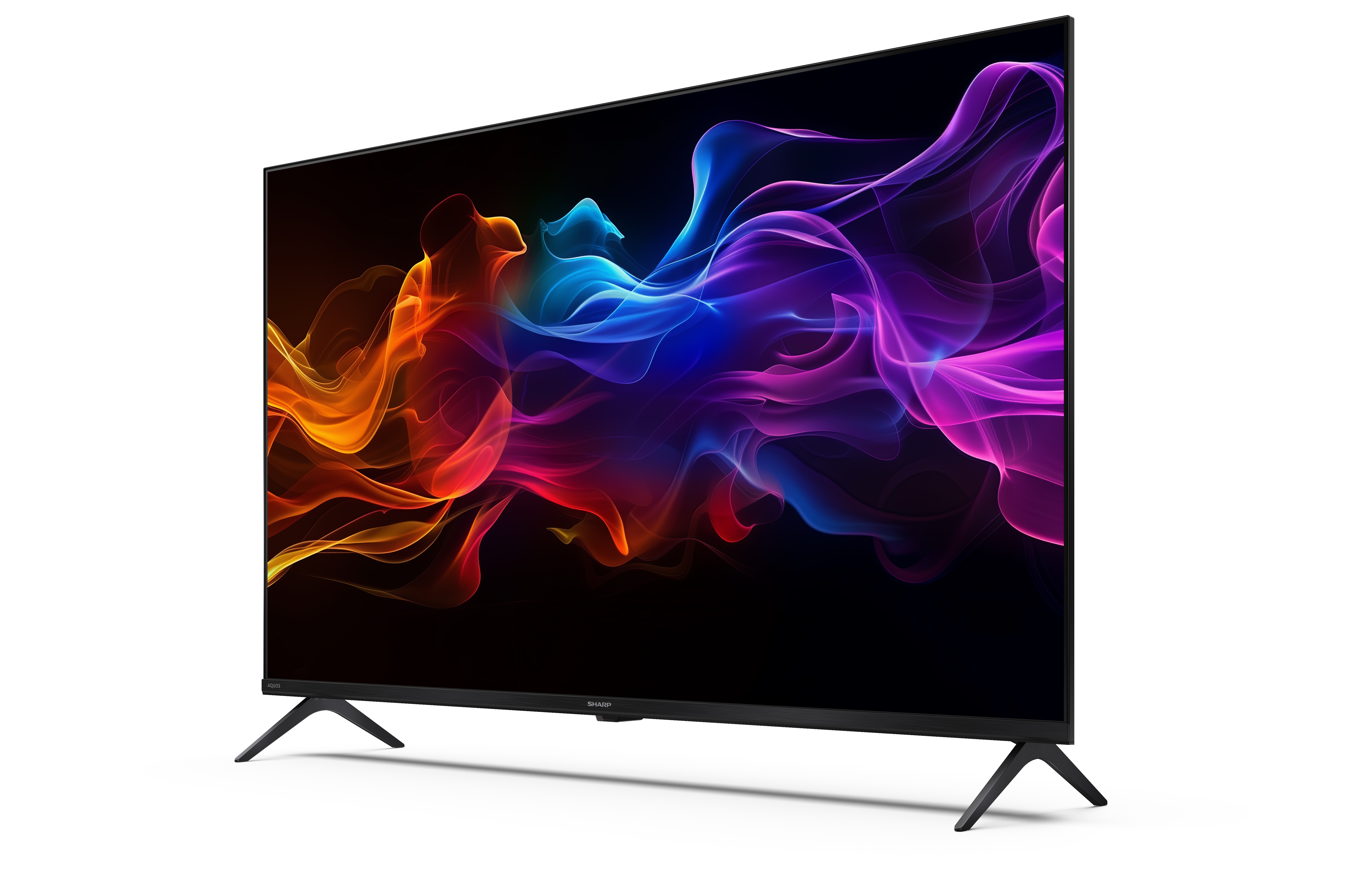 Egy fekete Sharp TV színes absztrakt művészetet jelenít meg. A TV fekete lábakkal és fehér háttérrel rendelkezik.
