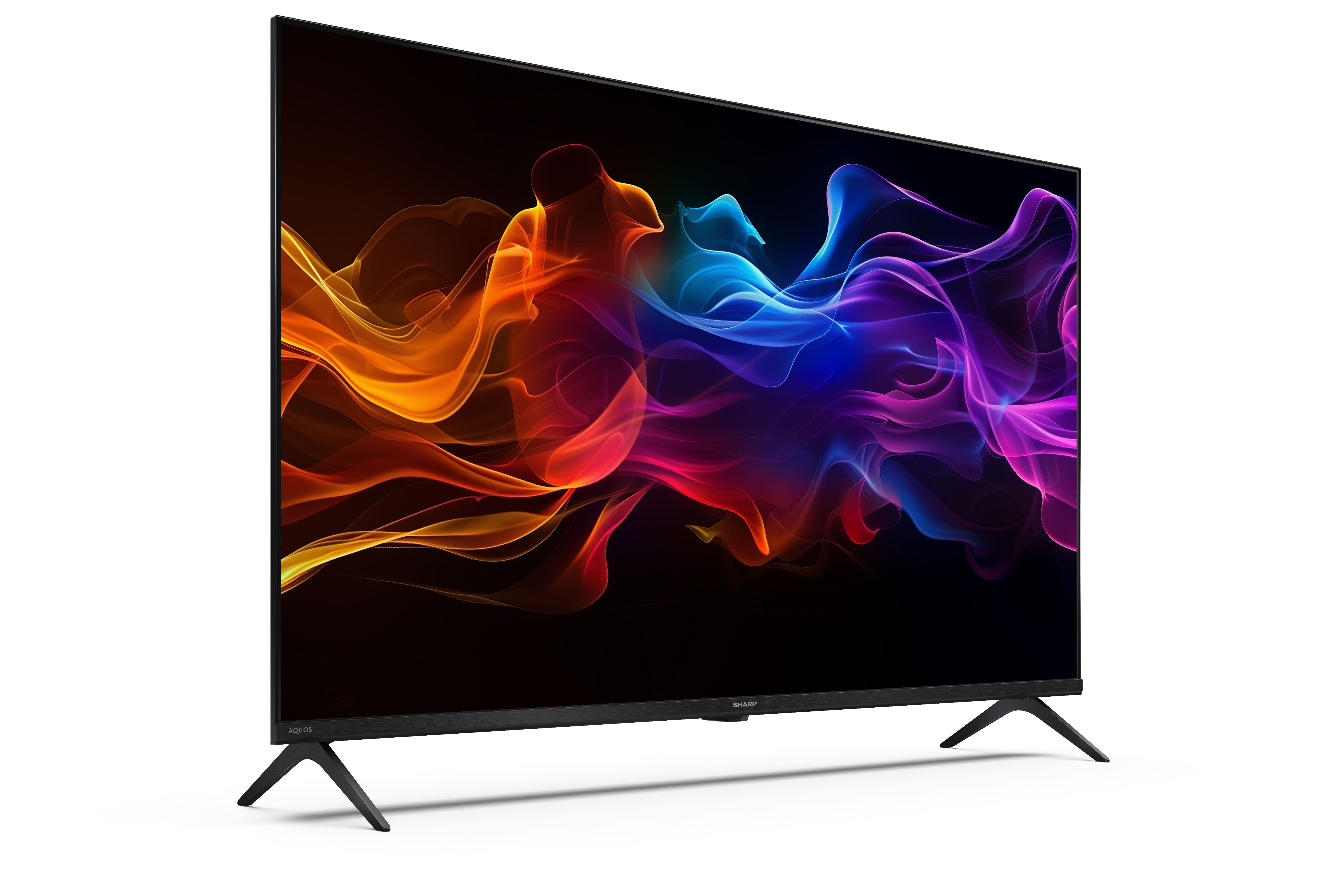 Egy nagyméretű fekete Sharp TV színes absztrakt formákat jelenít meg fekete háttéren, fekete lábakkal fehér felületen.