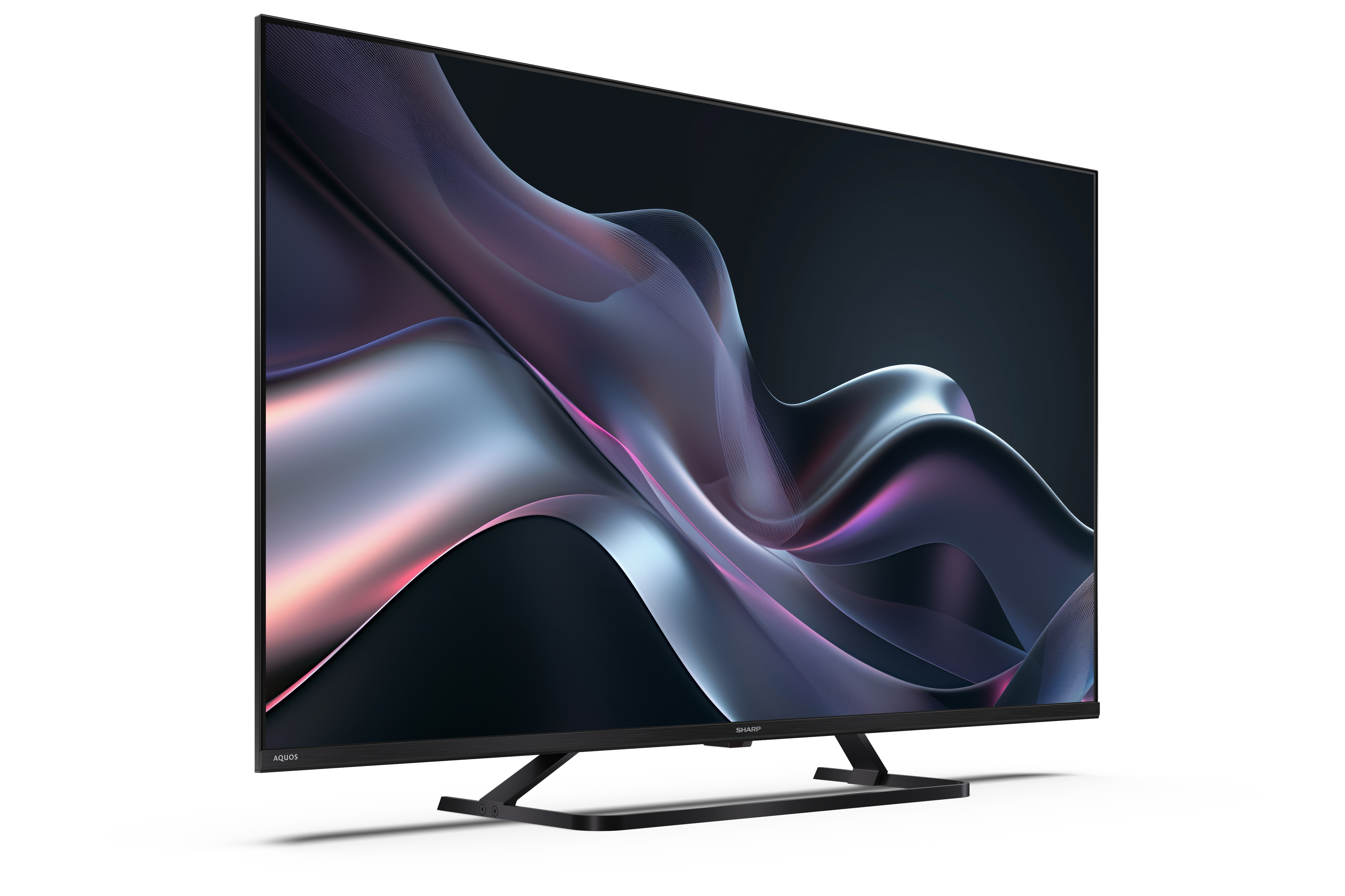 Egy nagyméretű fekete TV absztrakt dizájnt jelenít meg, folyó formákkal. A TV egy fekete állványon áll.