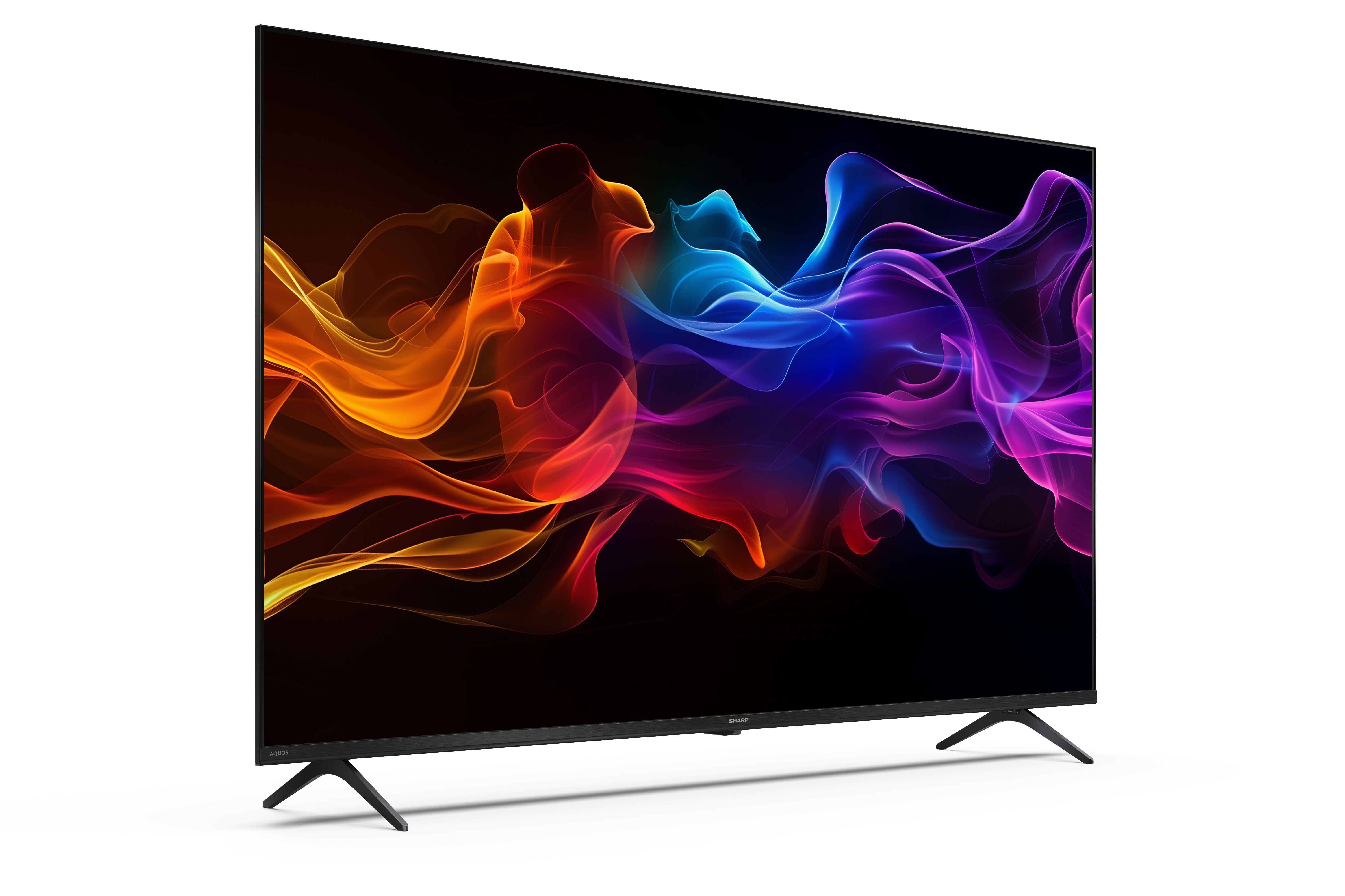 A Sharp TV absztrakt, színes dizájnt jelenít meg fekete képernyőn. A TV ferdén helyezkedik el.