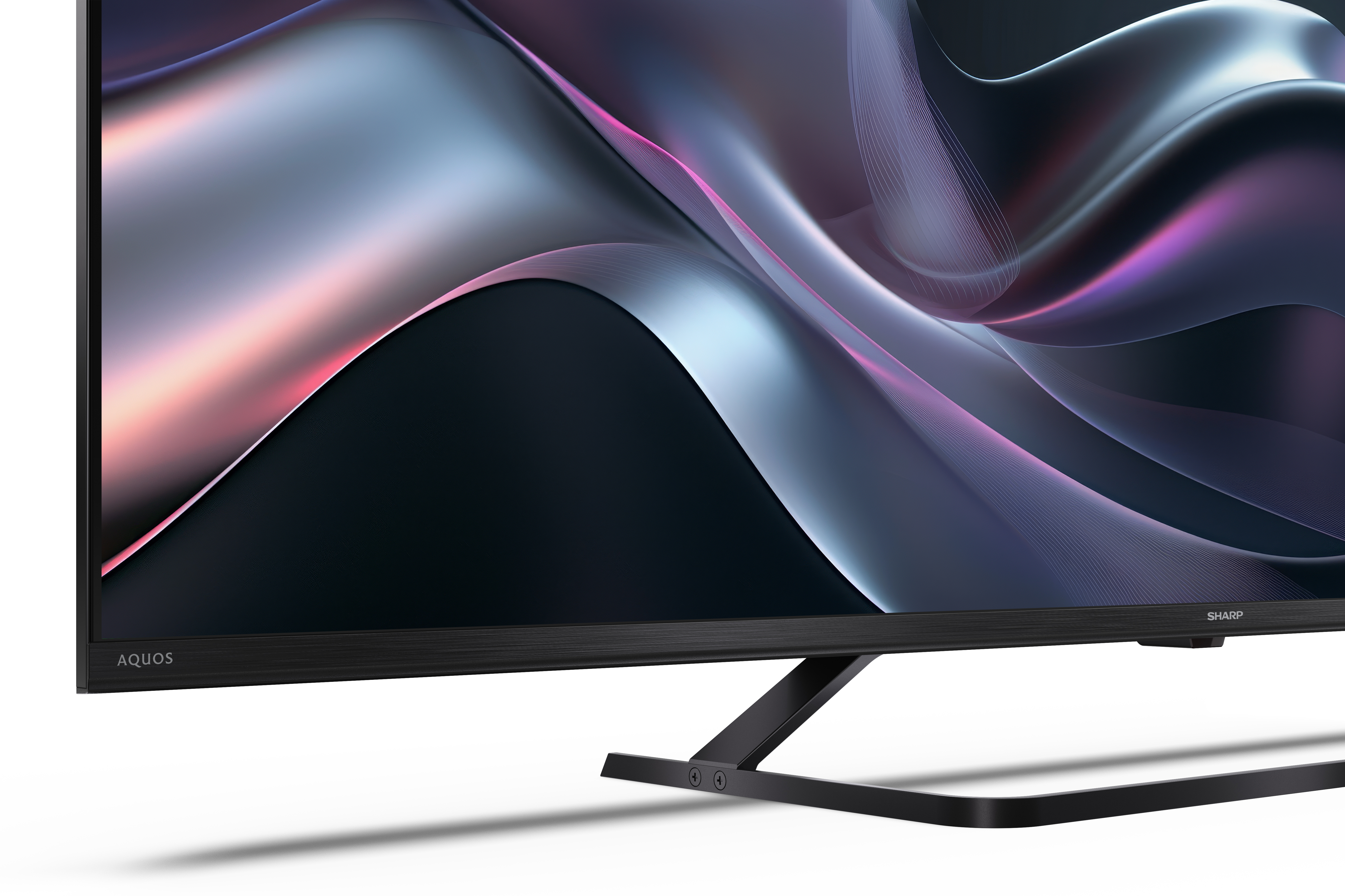 Egy modern TV közelképe fekete kerettel. A képernyő absztrakt, áramló dizájnt jelenít meg kék és rózsaszín árnyalatokkal.