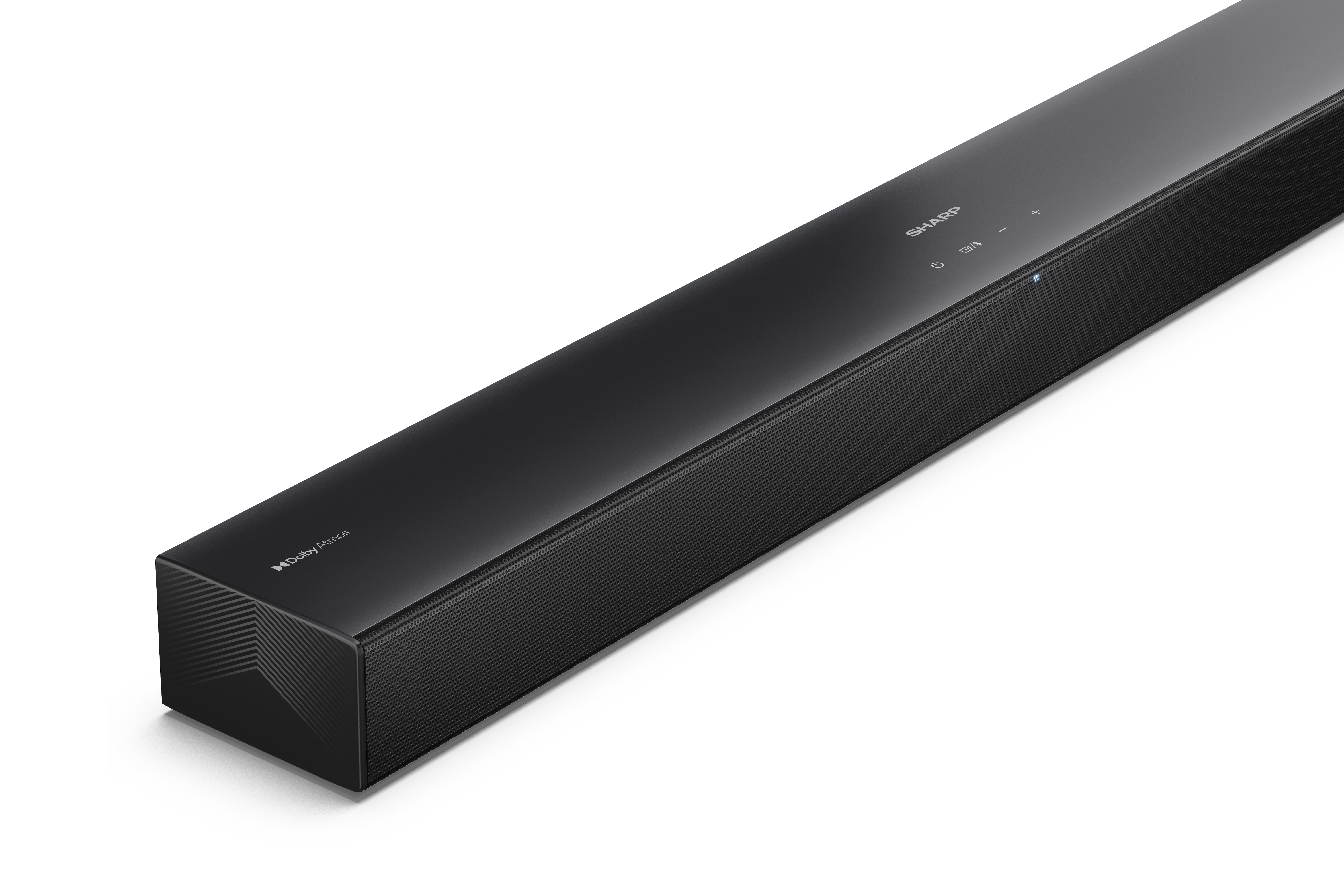 Fekete soundbar fehér felületen. Sharp logóval és Dolby Atmos felirattal. Az eleje hálós.