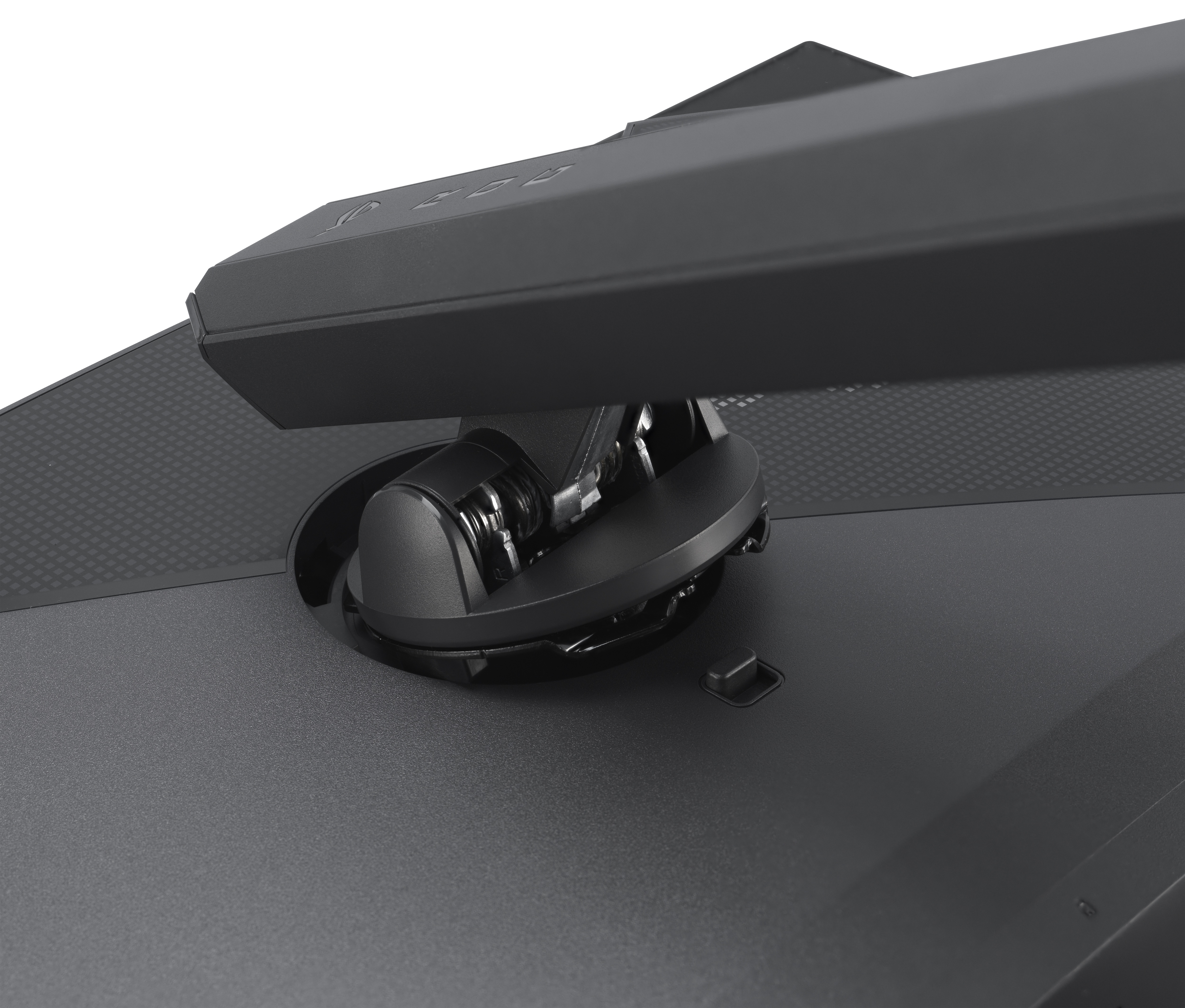 Zbliżenie czarnej podstawy monitora z mechanizmem obrotowym. Podstawa jest ciemnoszara, a tło białe.