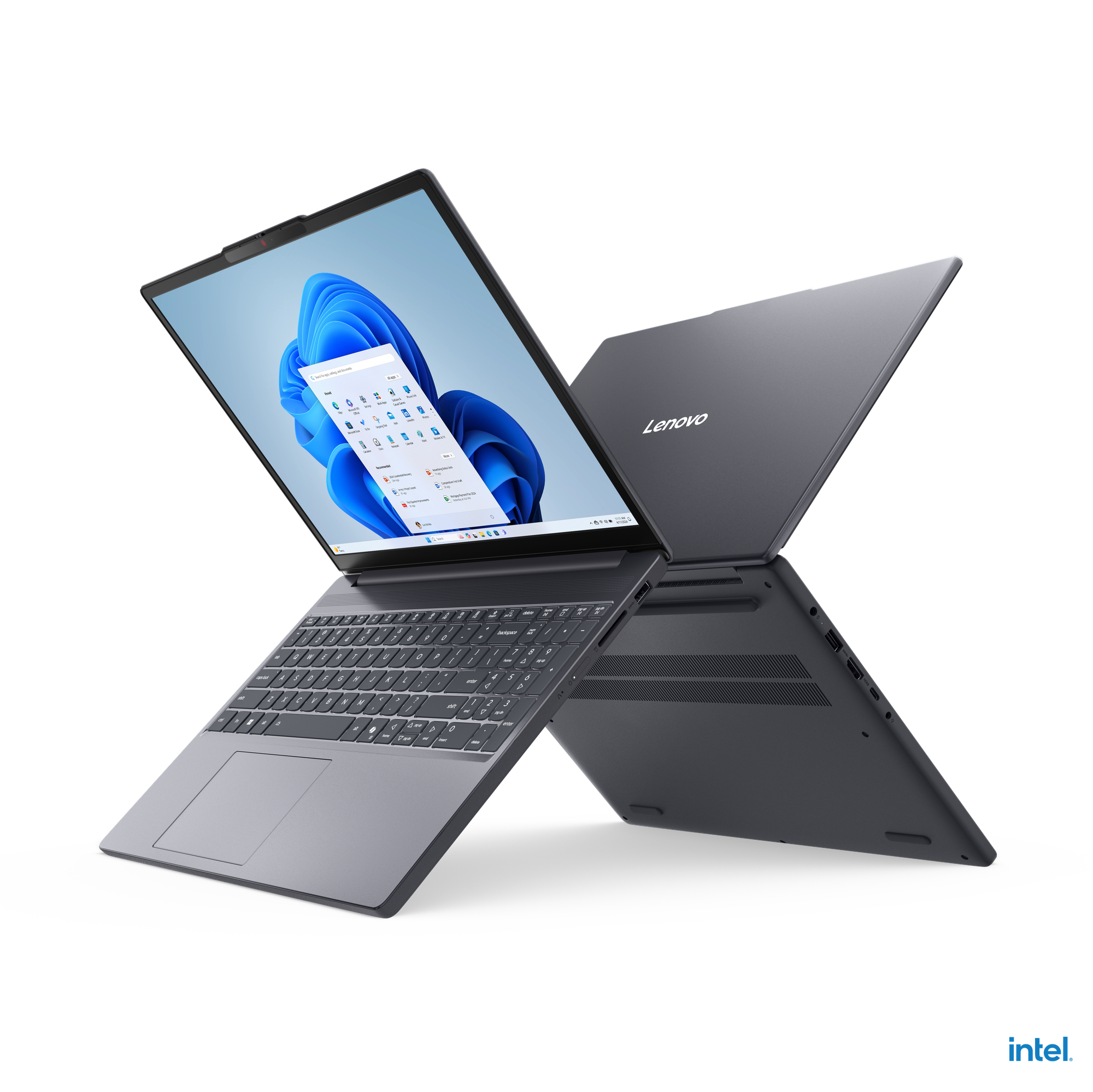 Gri bir Lenovo dizüstü bilgisayar, Windows arayüzünü göstererek açık, ekranı arkaya doğru eğilmiş. Arka plan siyah.