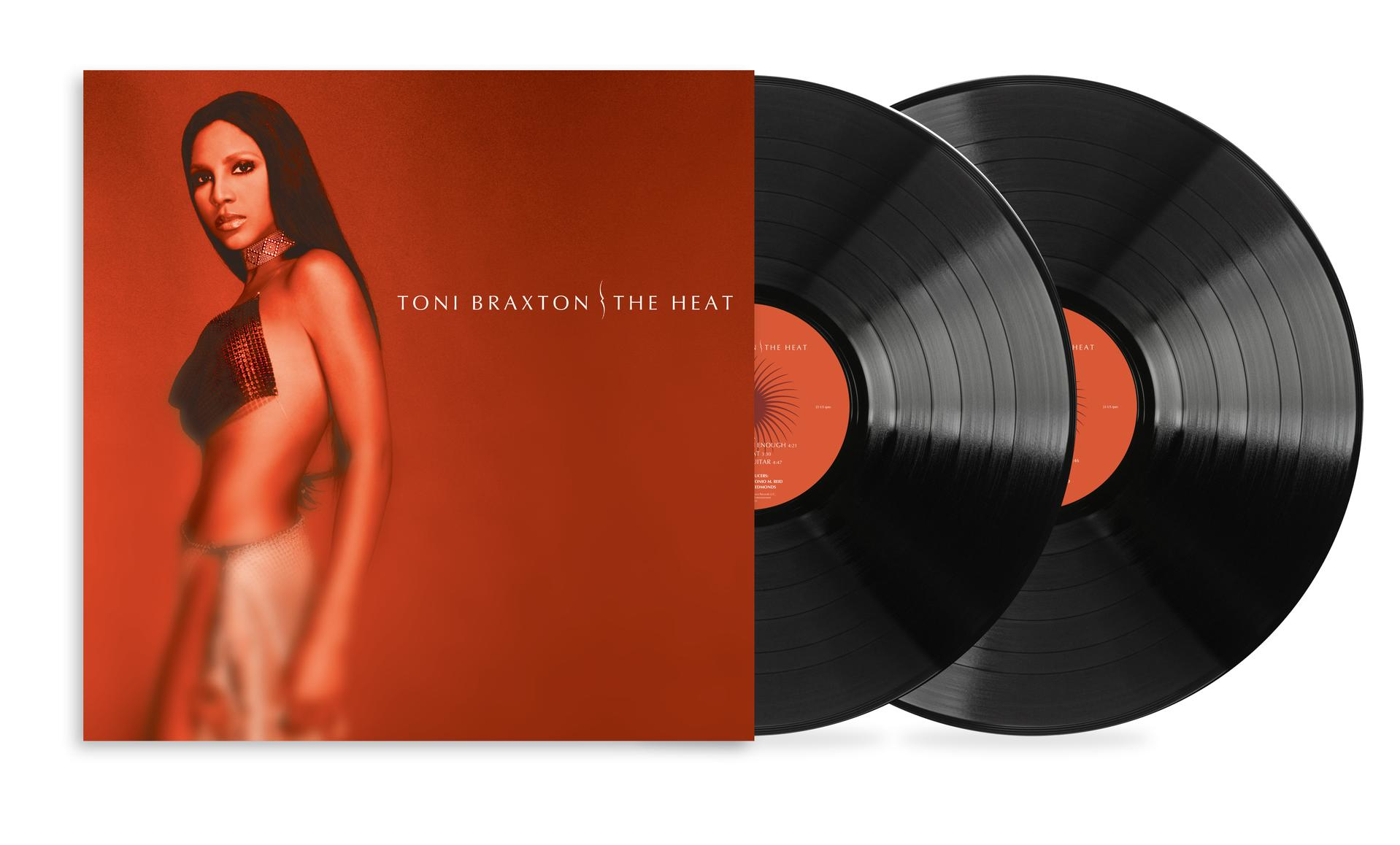 Toni Braxton Album "The Heat" mit zwei Schallplatten. Braxton ist auf dem Cover zu sehen. Rotes und oranges Farbschema.