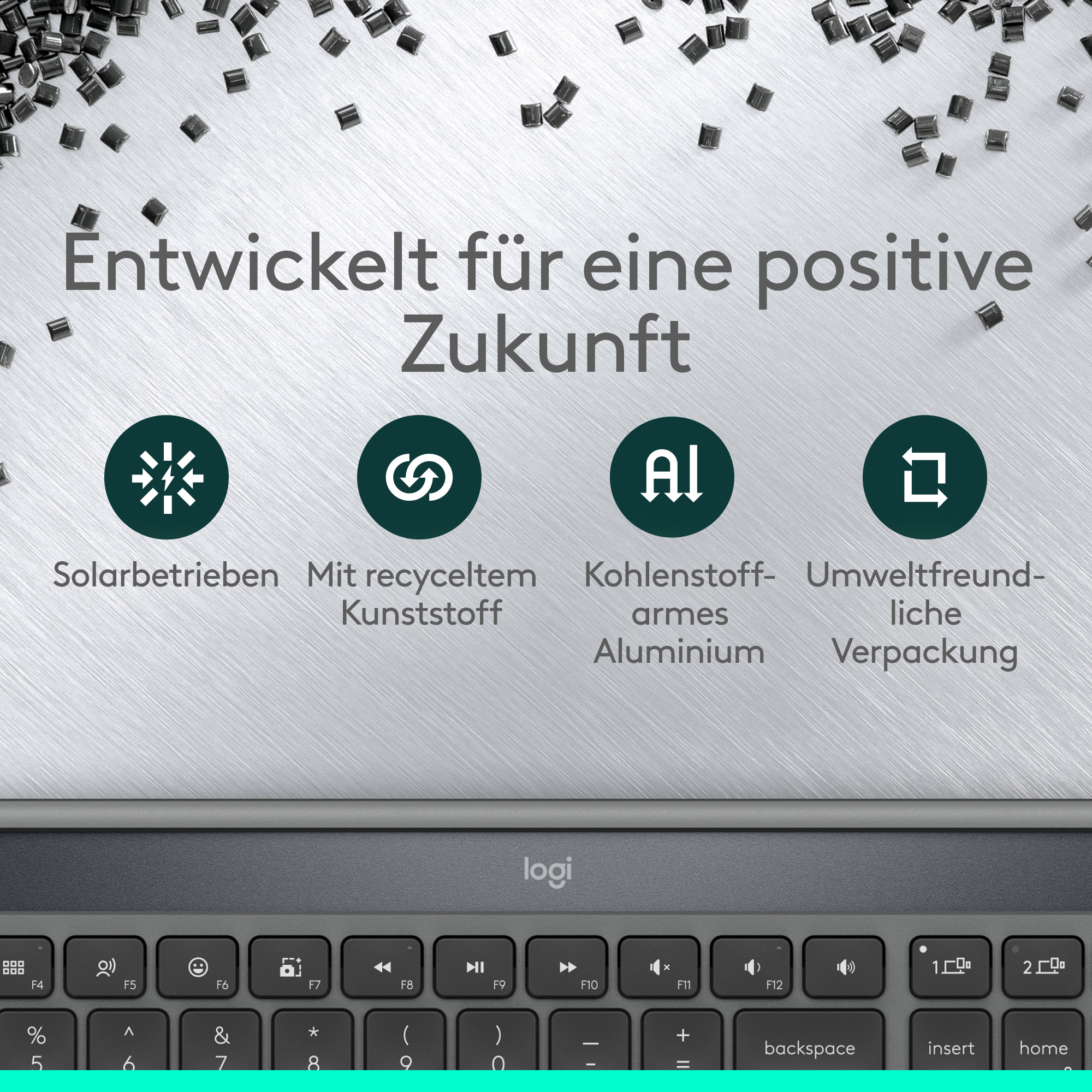 Das Bild zeigt eine Tastatur und Symbole. Der Text auf Deutsch wirbt für eine positive Zukunft. Solar, recycelter Kunststoff, Aluminium und umweltfreundlich.