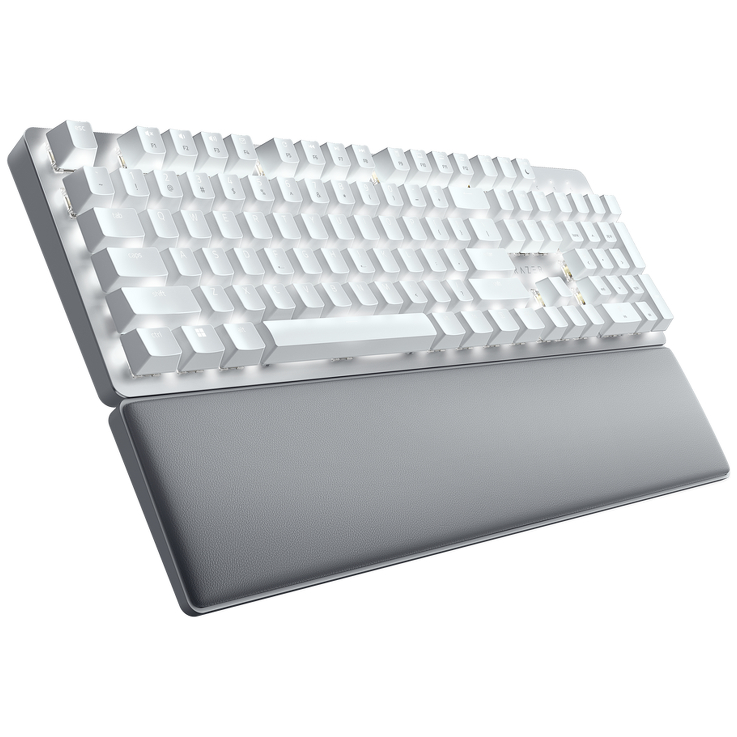 A white keyboard with a gray wrist rest is on a white background. The keyboard keys are lit. The setup is angled.