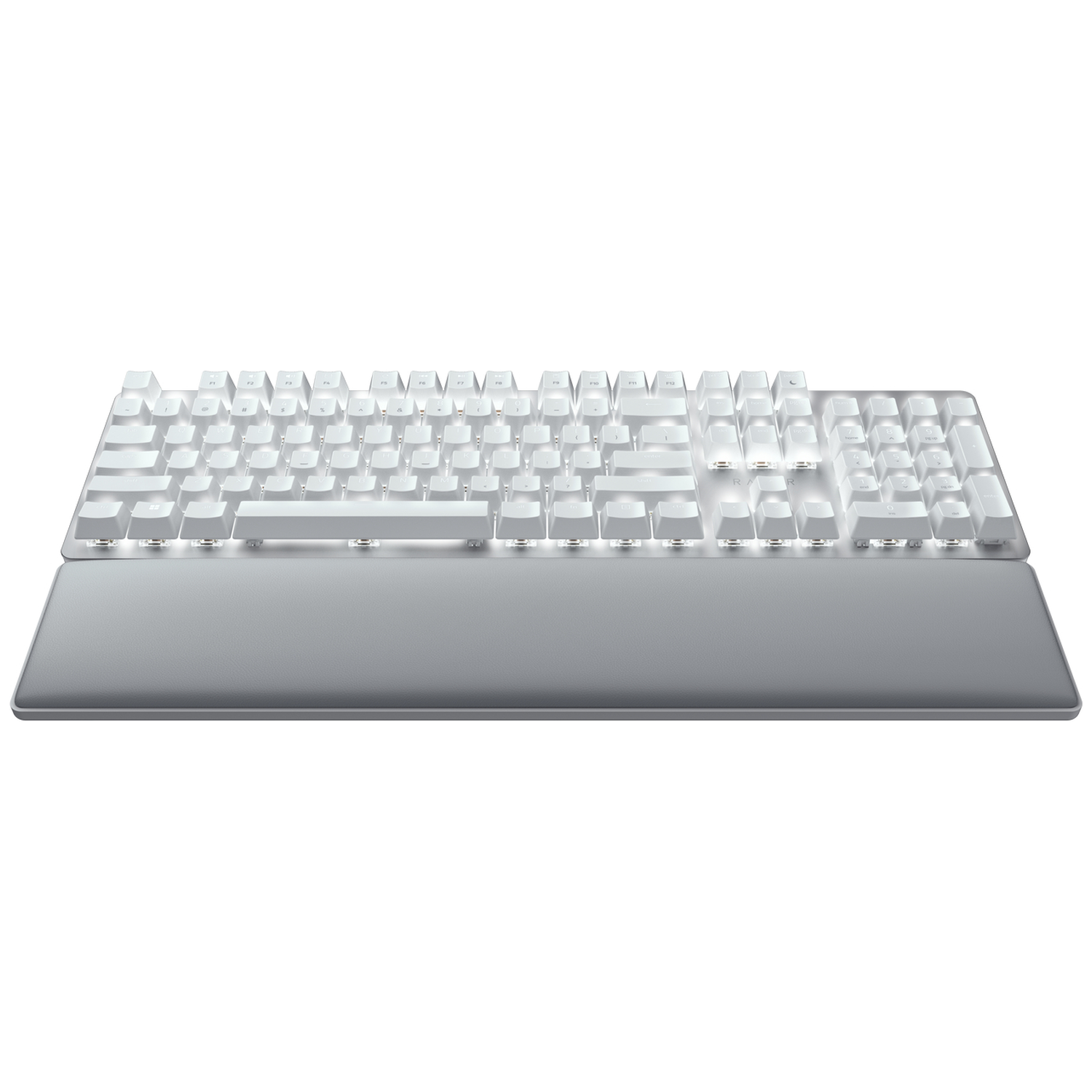 A white keyboard with a gray wrist rest, all on a white background. The keyboard has multiple keys and a numeric keypad.