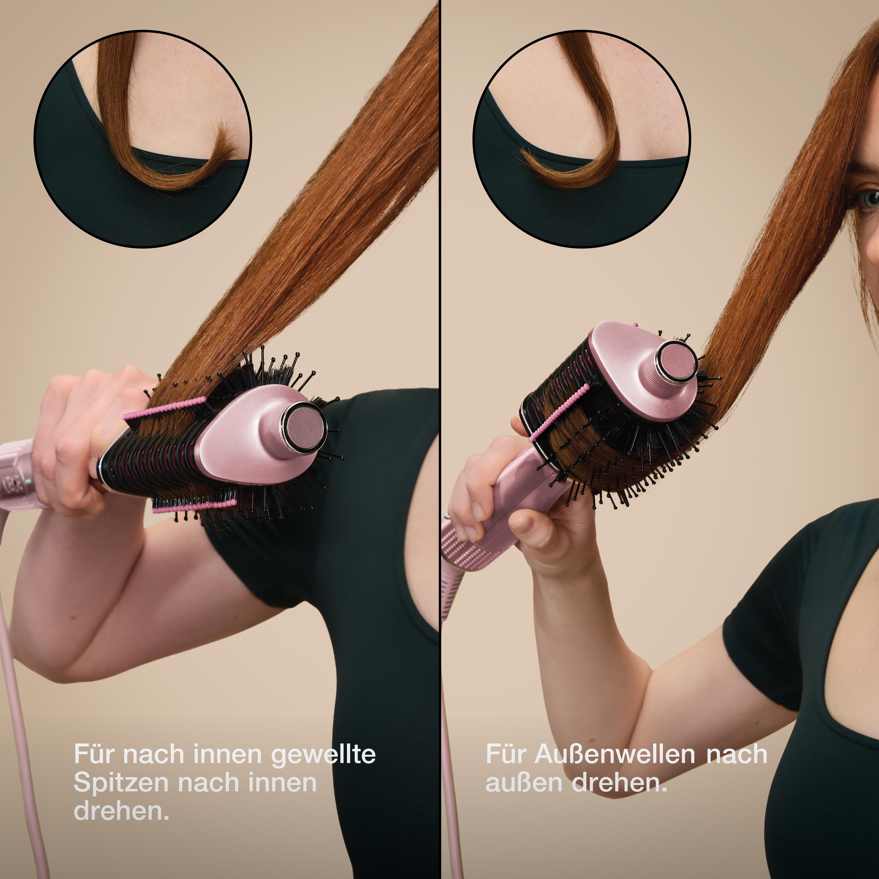 Bild zeigt Haarstyling. Eine Person verwendet ein rosa-schwarzes Haarstyling-Werkzeug auf rotbraunem Haar.