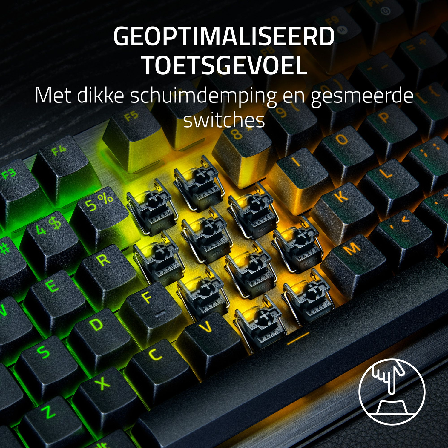 Close-up of a black keyboard with green and yellow backlighting. Keys are labeled, and the focus is on the switches and keycaps.