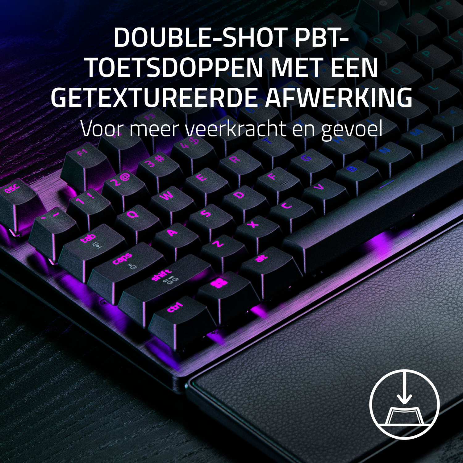 Close-up of a black keyboard with pink illuminated keys. The keyboard has a wrist rest. The text says 'DOUBLE-SHOT PBT'.