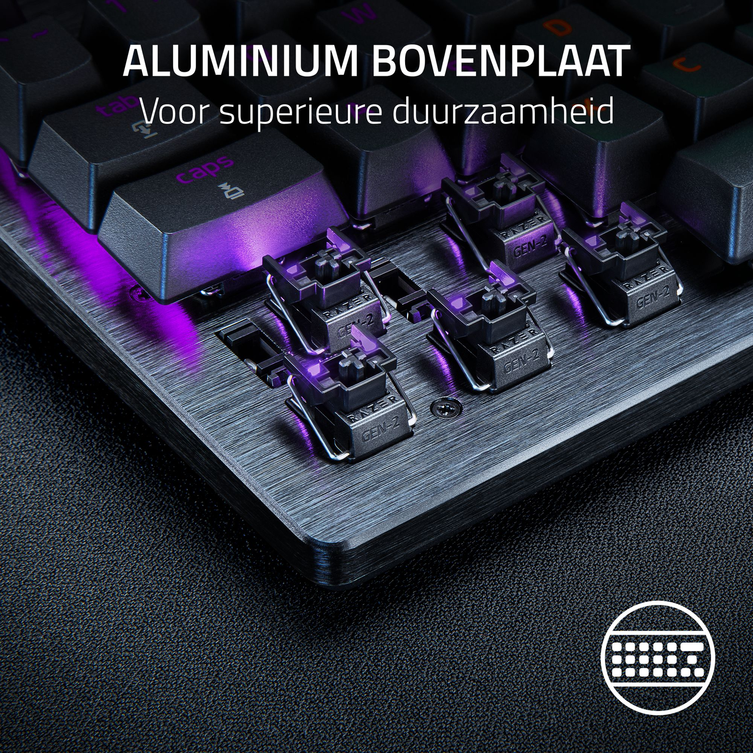 Close-up of a black keyboard with purple backlighting. Aluminum top plate. Razer Gen-2 switches are visible. The background is a textured black surface.