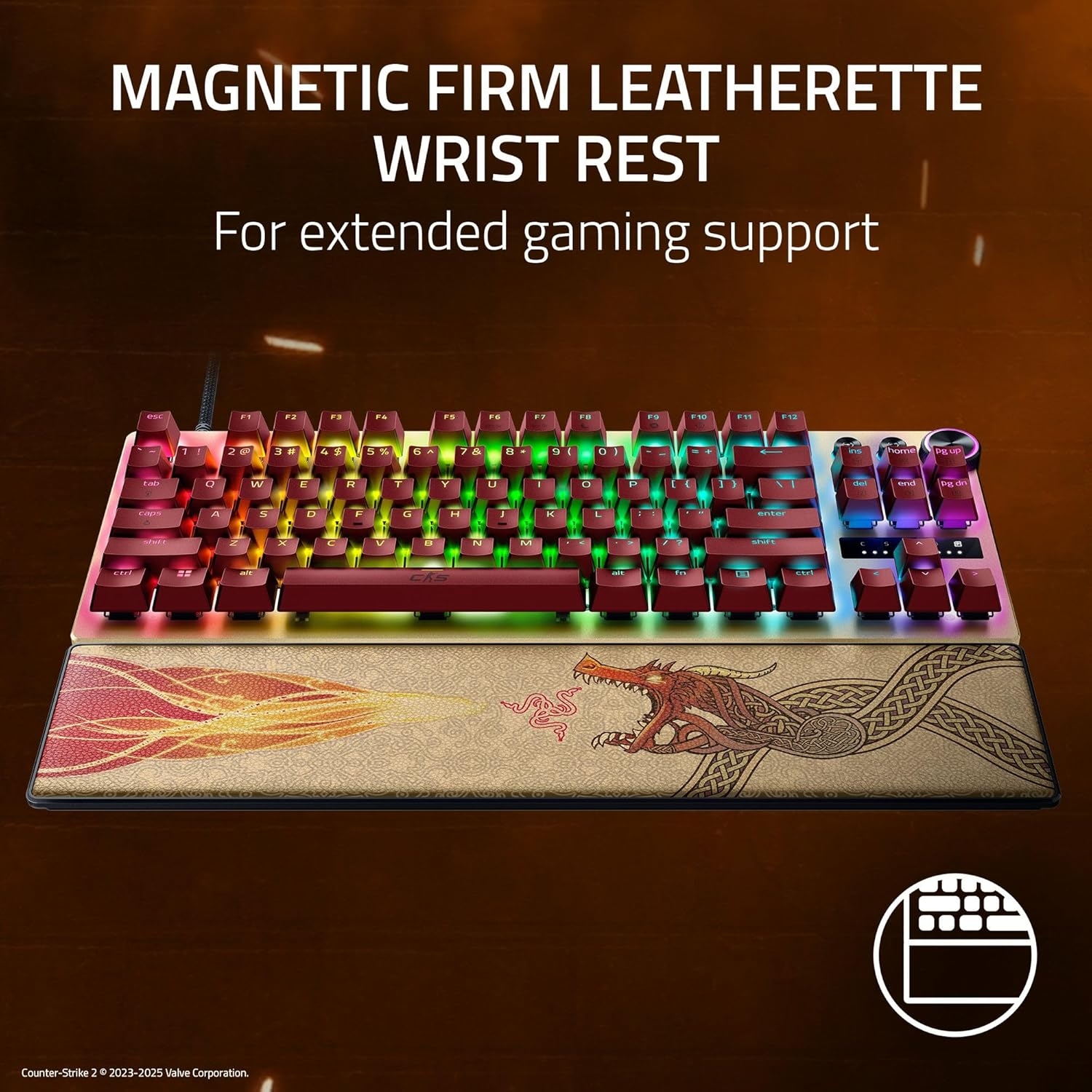 Gaming keyboard with red keys and a dragon wrist rest. The keyboard has colorful lights.