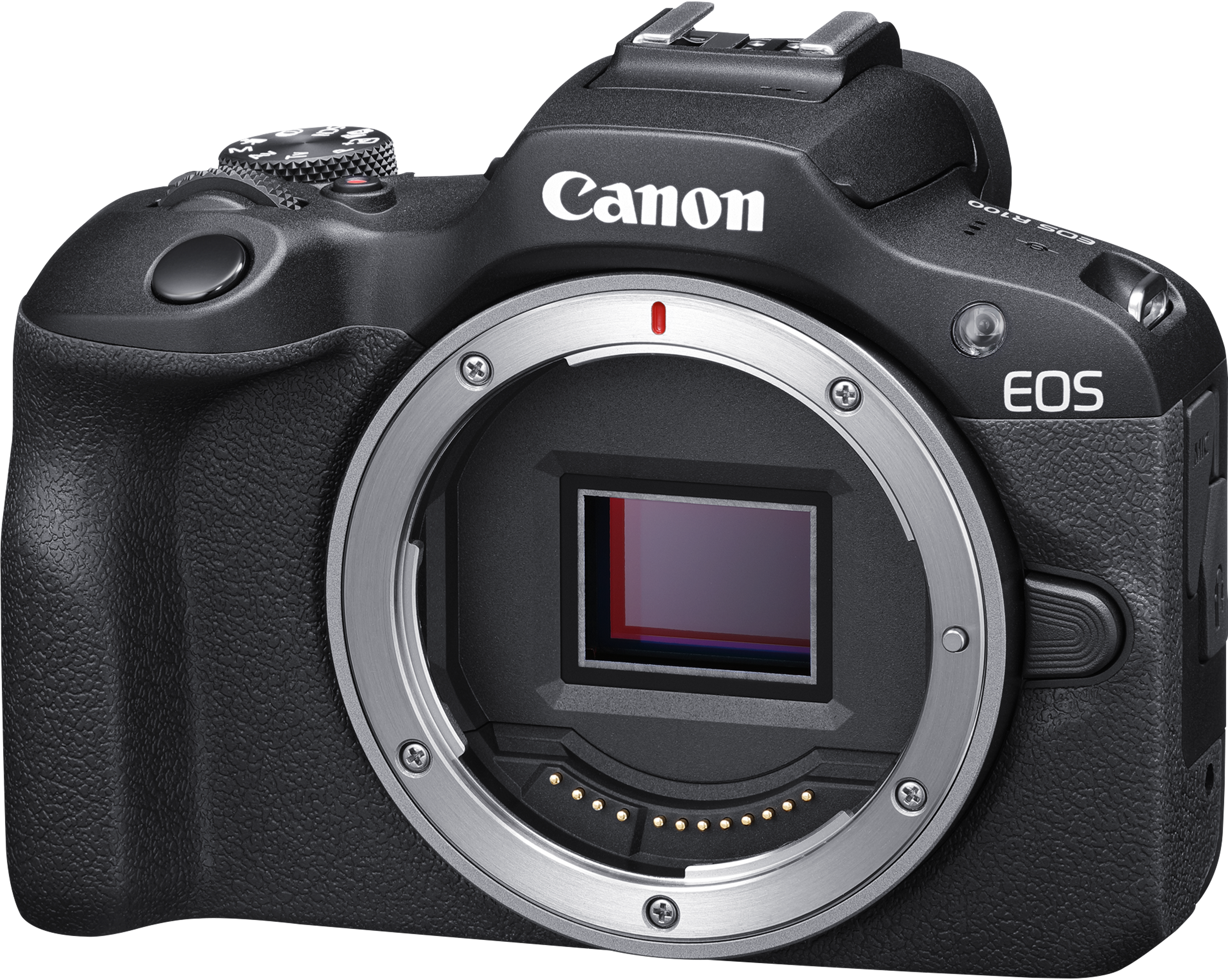 Un appareil photo Canon EOS R100 noir. La monture d'objectif est argentée. Le logo Canon est visible. L'appareil photo est sur fond blanc.