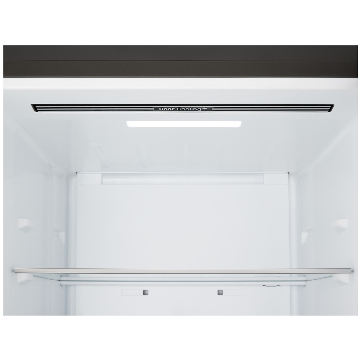 Inside of a white refrigerator. A shelf and the 'Door Cooling+' vent are visible. Black top and a light in the middle.