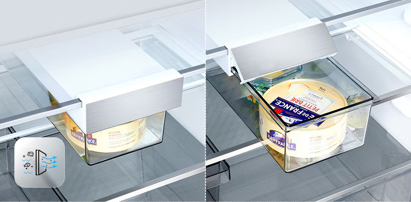 W lodówce widoczne są dwa kręgi sera w przezroczystych szufladach. Szuflady znajdują się pod białą półką.