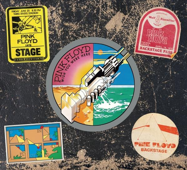 Das Bild zeigt Pink Floyd-Aufkleber: Konzertdaten, Backstage-Pässe und Albumcover auf einer strukturierten schwarzen Oberfläche.