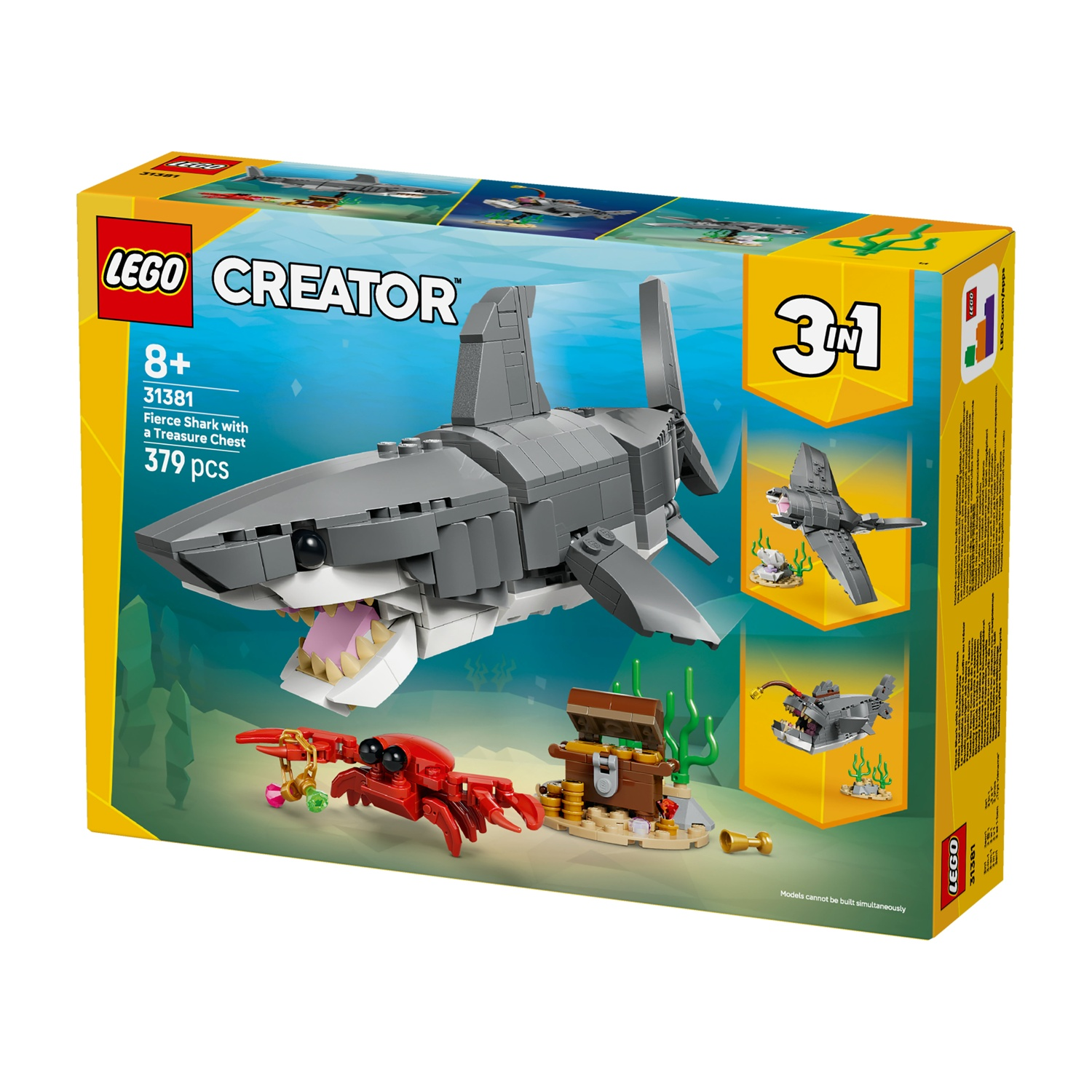 Scatola Lego di uno squalo con un forziere. La scatola mostra anche un aereo e un pesce con uno squalo.