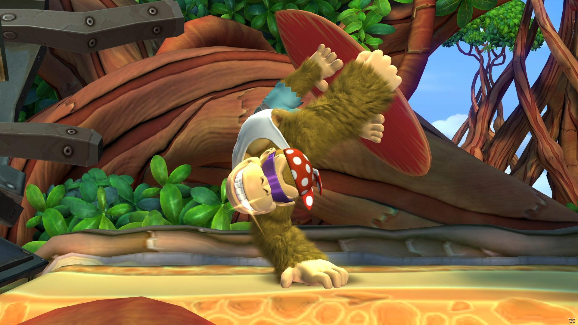 Donkey Kong do góry nogami, trzymający deskę surfingową. Ma na sobie białą koszulę, fioletową maskę i czerwoną bandanę z białymi kropkami.