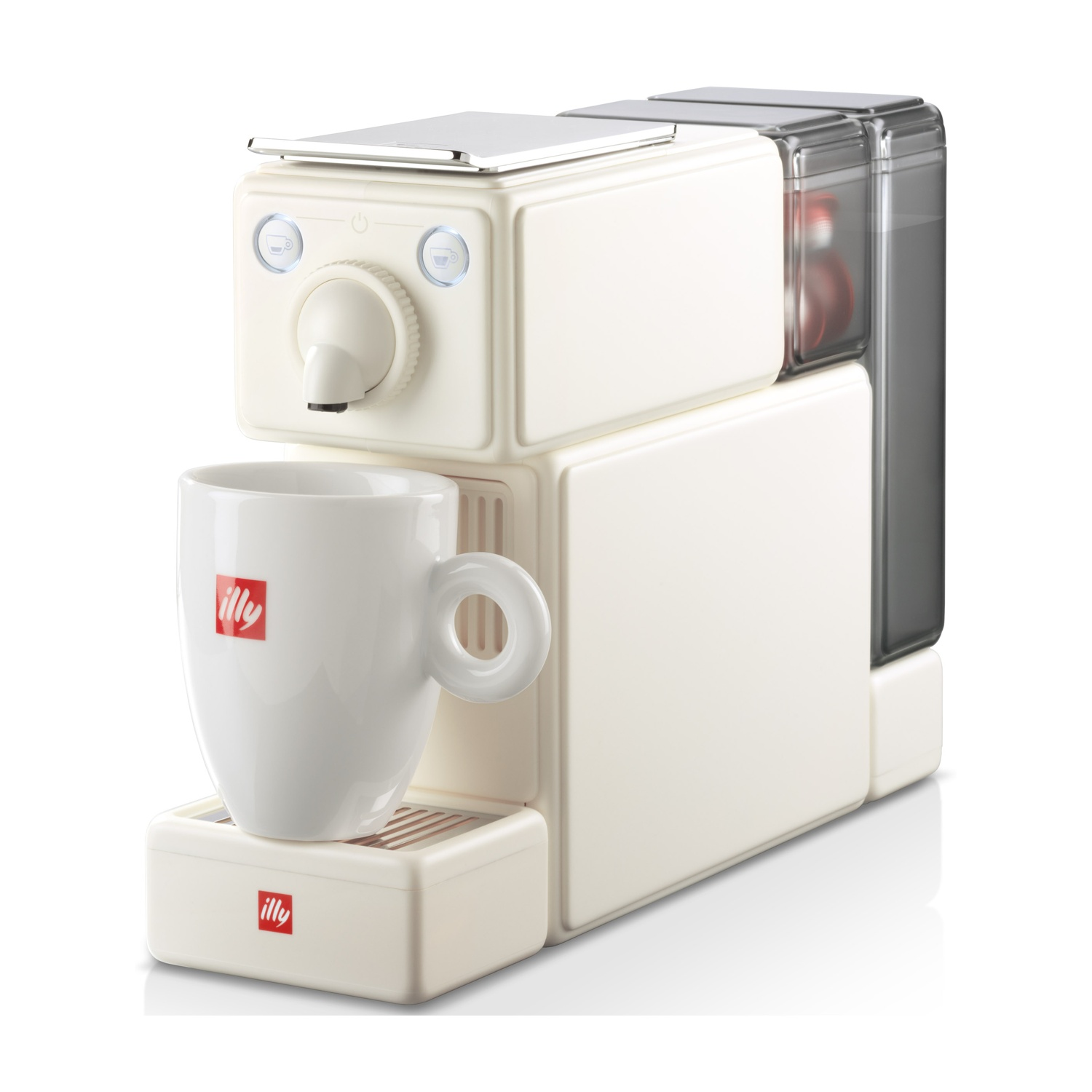 Una macchina da caffè Illy bianco sporco con una tazza bianca. La macchina ha un contenitore trasparente. La tazza ha il logo Illy.