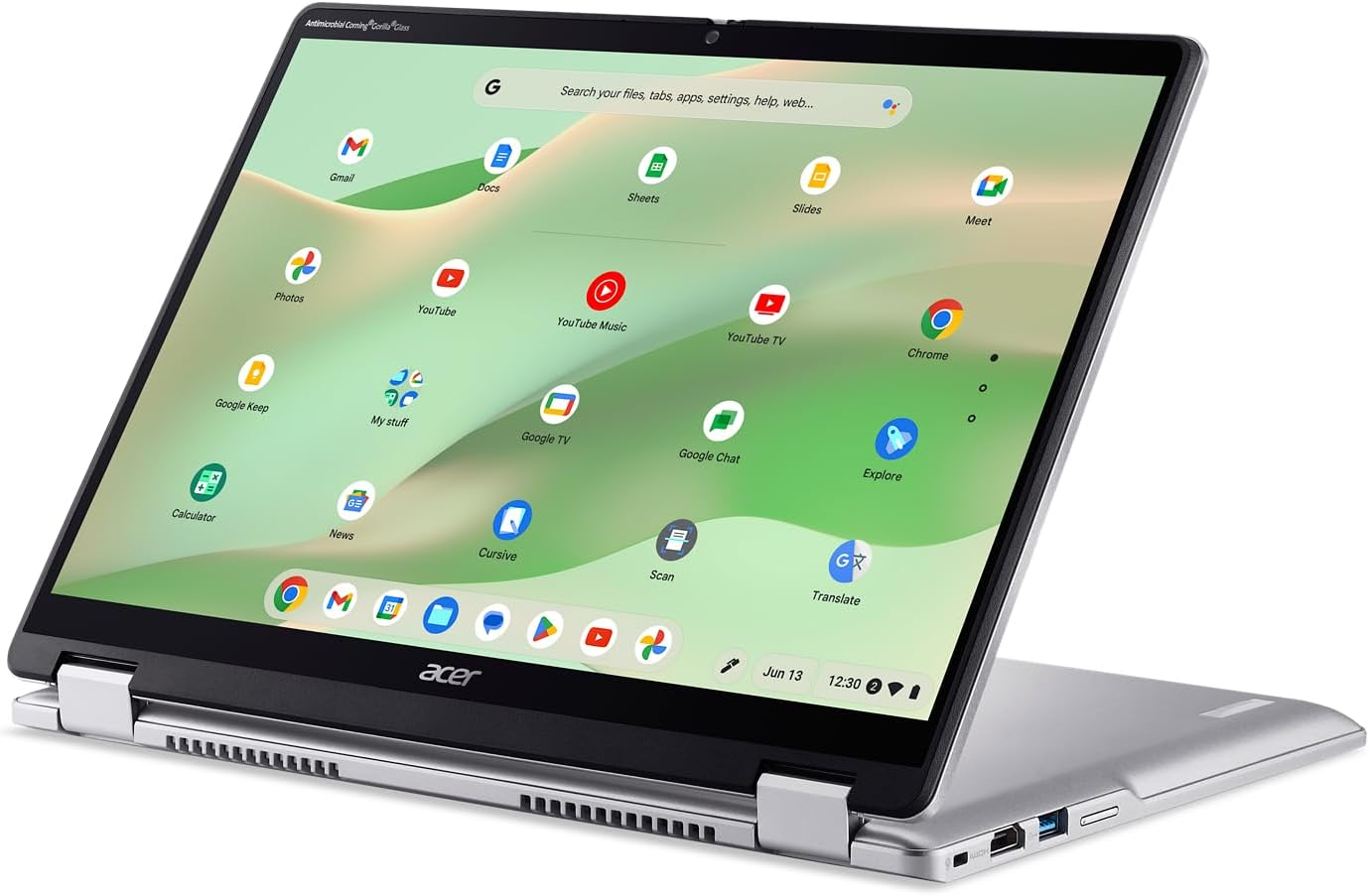 Zilveren Acer-laptop met het scherm open en app-pictogrammen weergegeven. Het scherm toont Google-apps zoals Gmail, YouTube en Chrome.