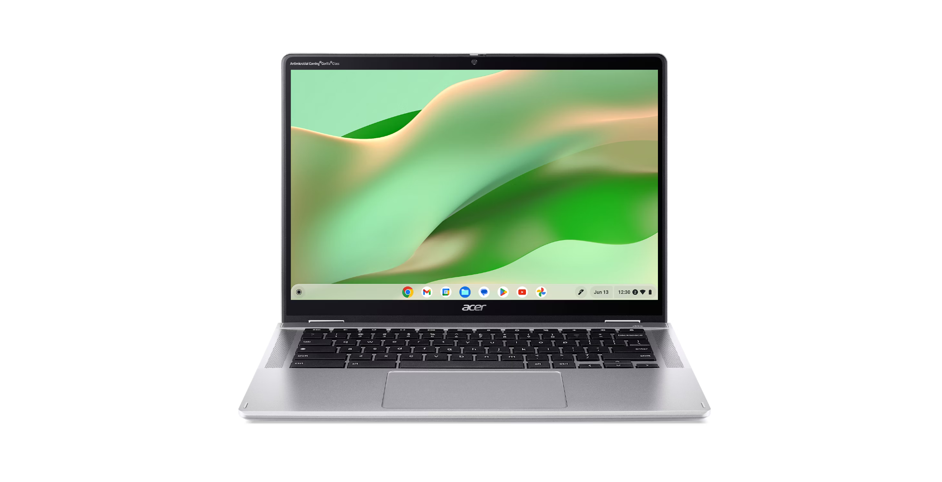 Zilveren Acer-laptop met een groen-witte abstracte achtergrond. Het scherm toont app-pictogrammen. Het toetsenbord is zwart.