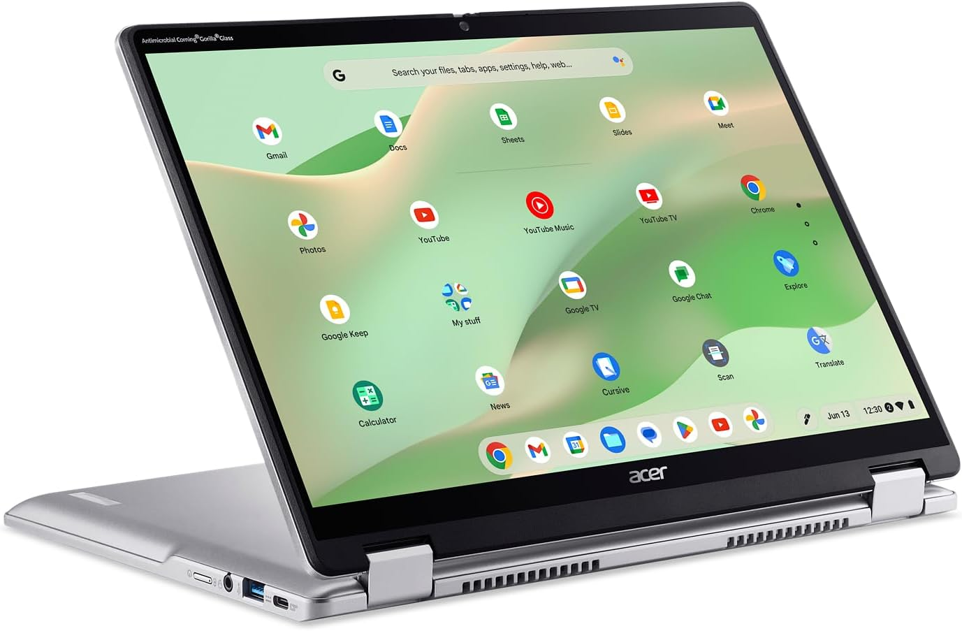 Zilveren Acer laptop open, met een groen scherm met app-iconen. Chrome browser open met zoekbalk.