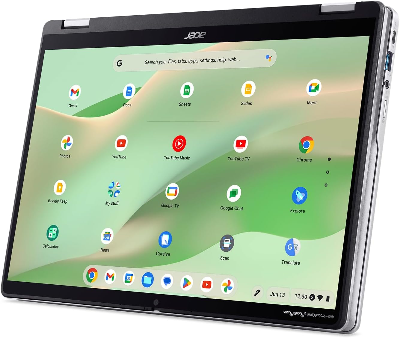 Acer Chromebook tablet op een bureau, het scherm toont apps zoals Gmail, YouTube en Google Chrome. De tijd is 12:30.