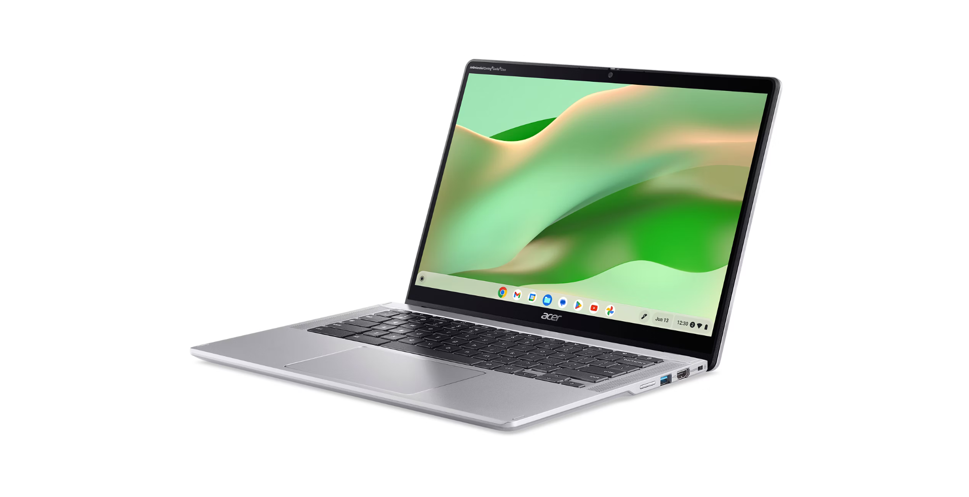 Zilveren Acer Chromebook laptop open, met een groen en witte abstracte achtergrond op het scherm. Het toetsenbord is zichtbaar.