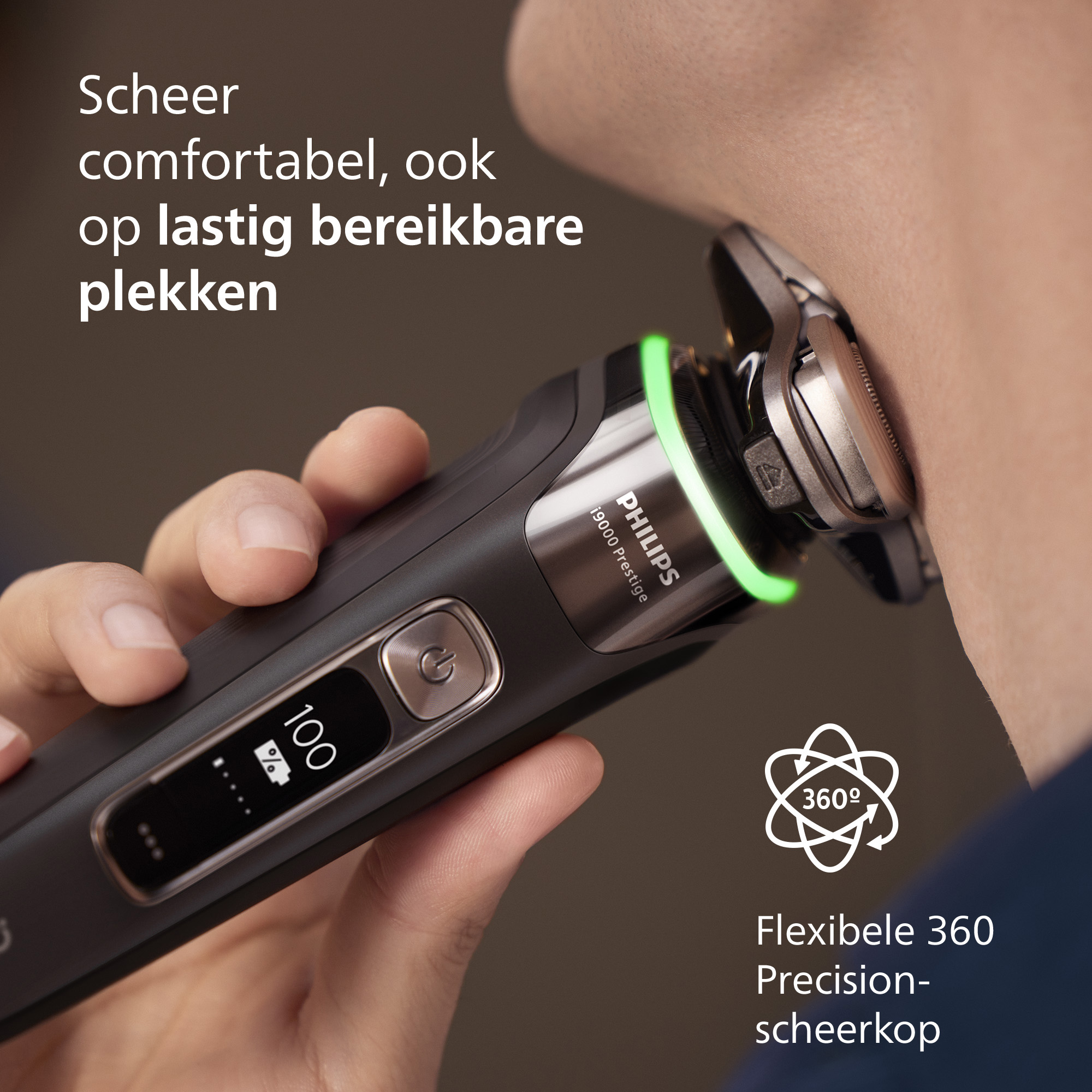 A man shaves his neck with a black Philips shaver. The shaver has a green light and a digital display.