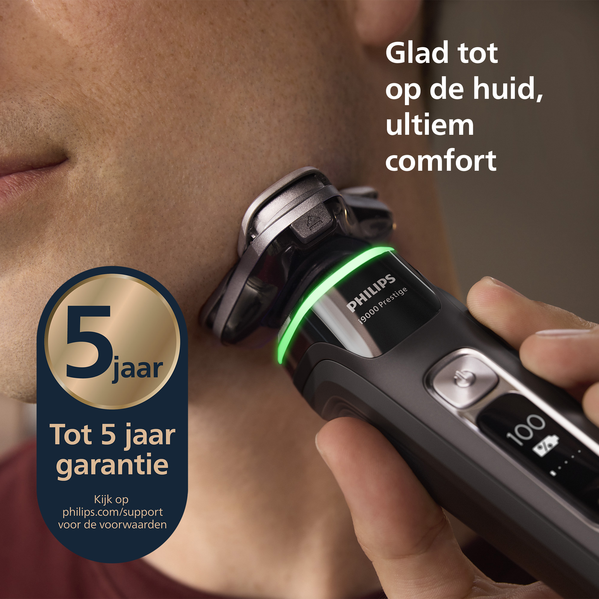 A person shaves their face with a Philips electric shaver. A logo indicates a 5-year warranty.